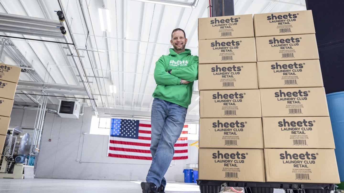 Chris Videau, founder of N.C.-based Sheets Laundry Club, shows off his product