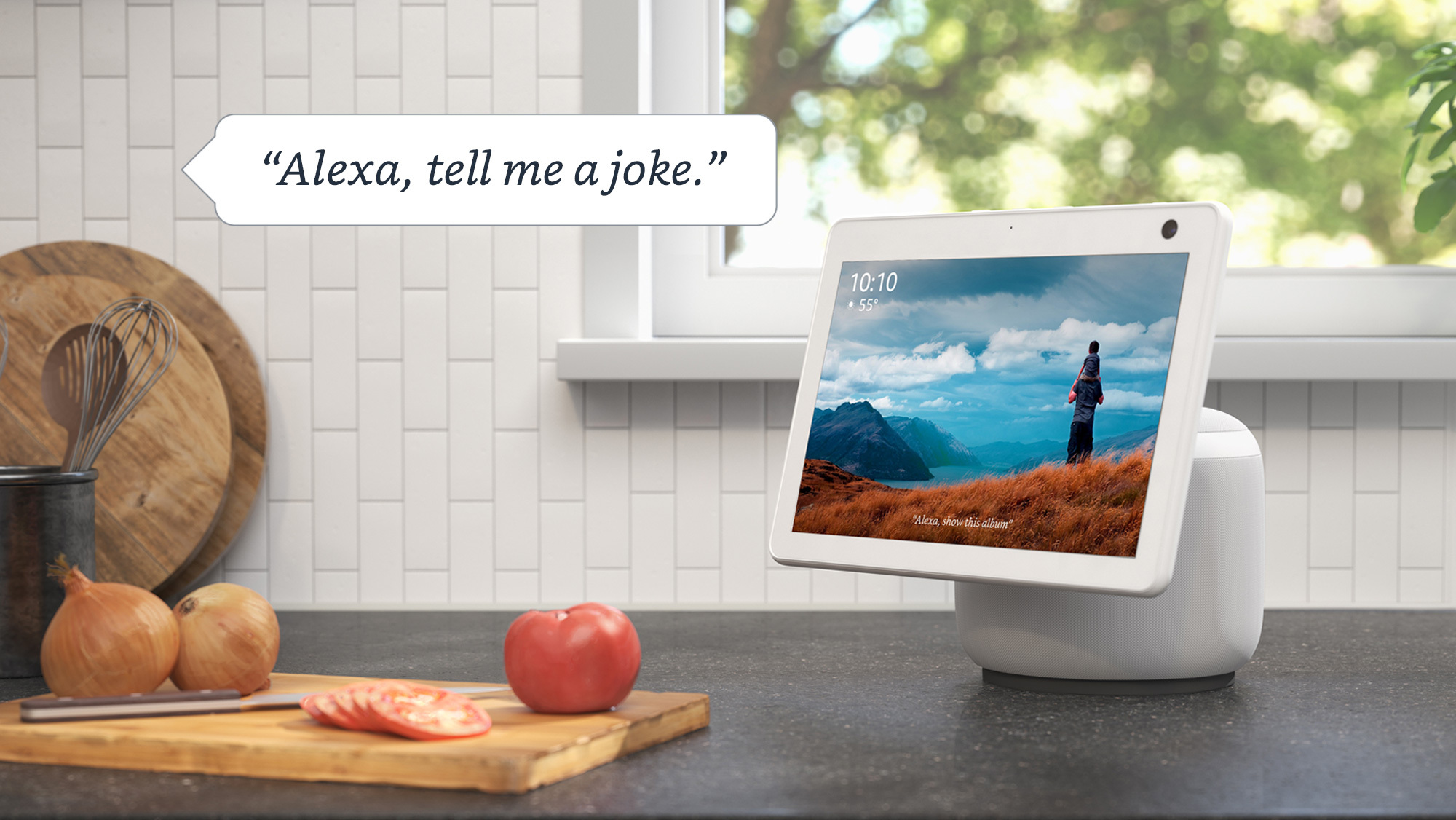 An image of an Amazon device in a kitchen and text that reads "Alexa, tell me a joke."