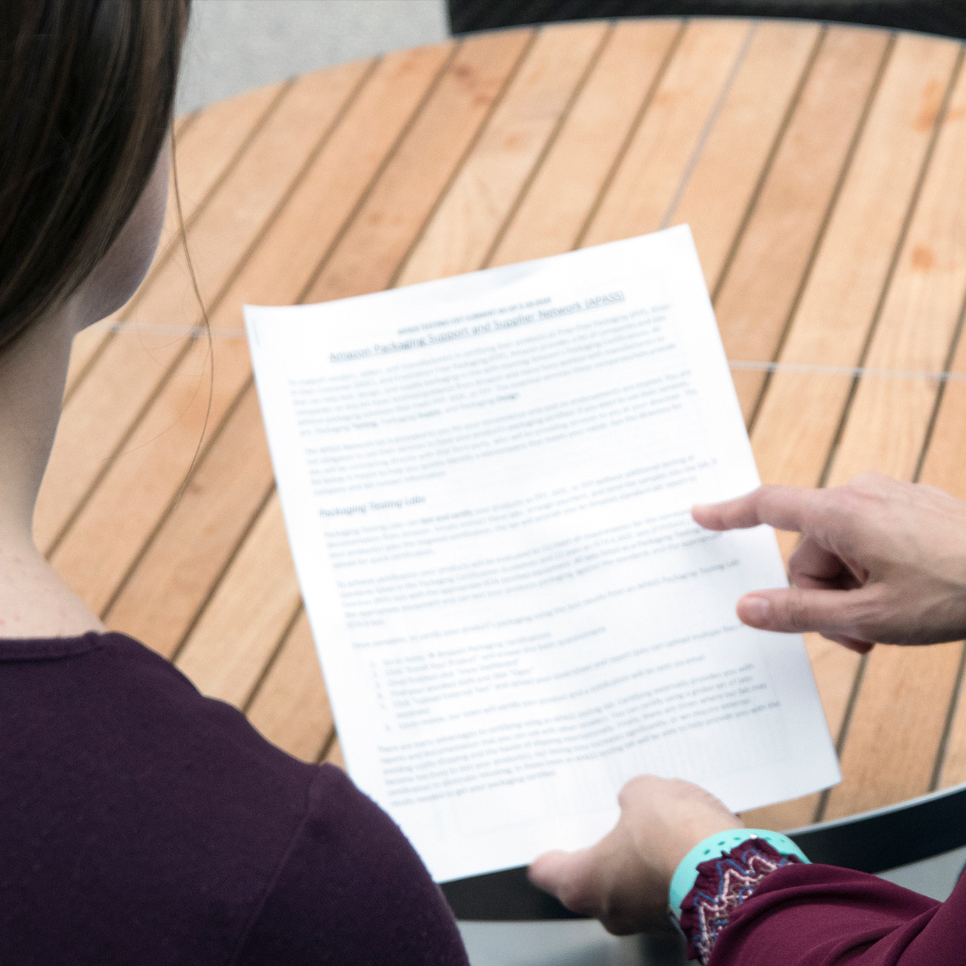 Two people looking at a piece of paper