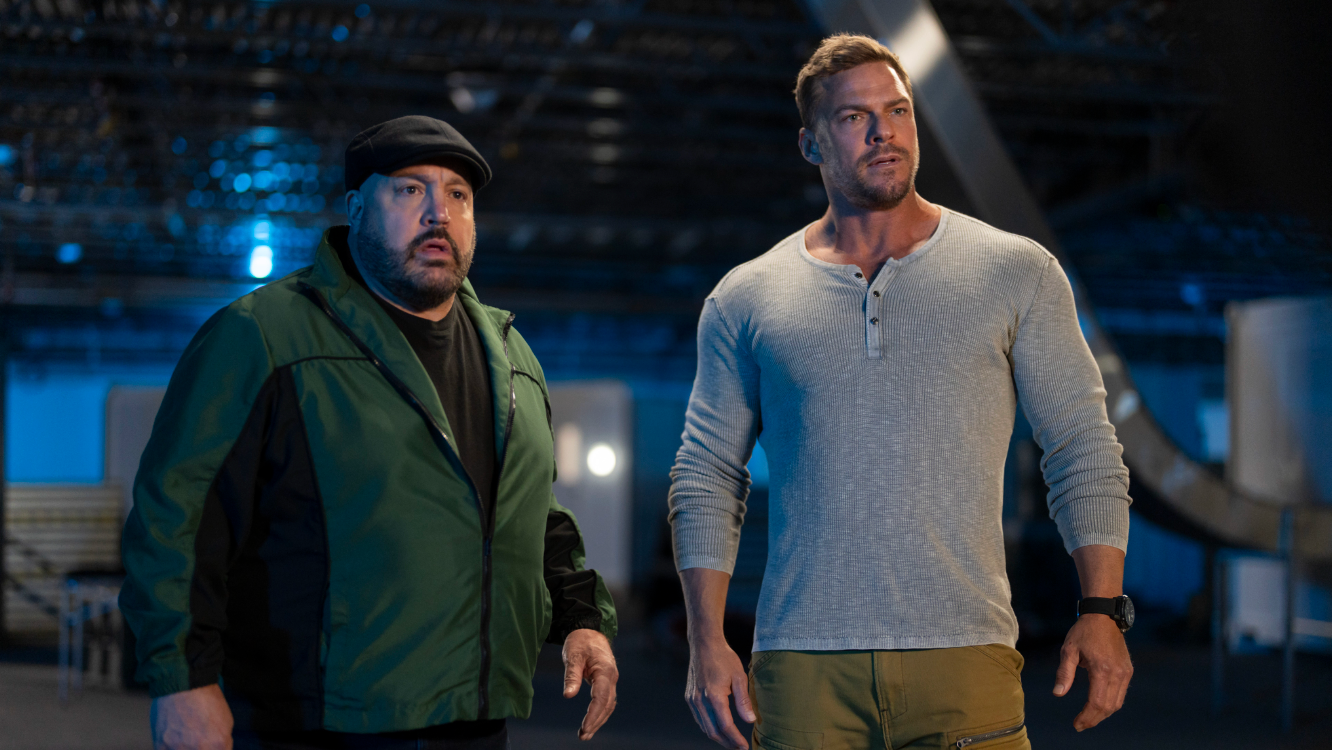 Stocky man in green jacket and cap next to muscular man in white henley; 'Playdate' movie