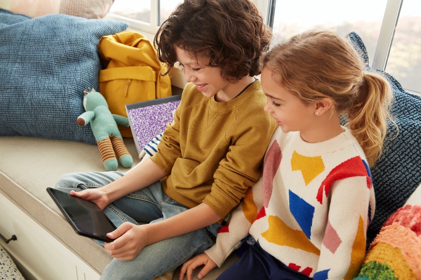 two children use an amazon device