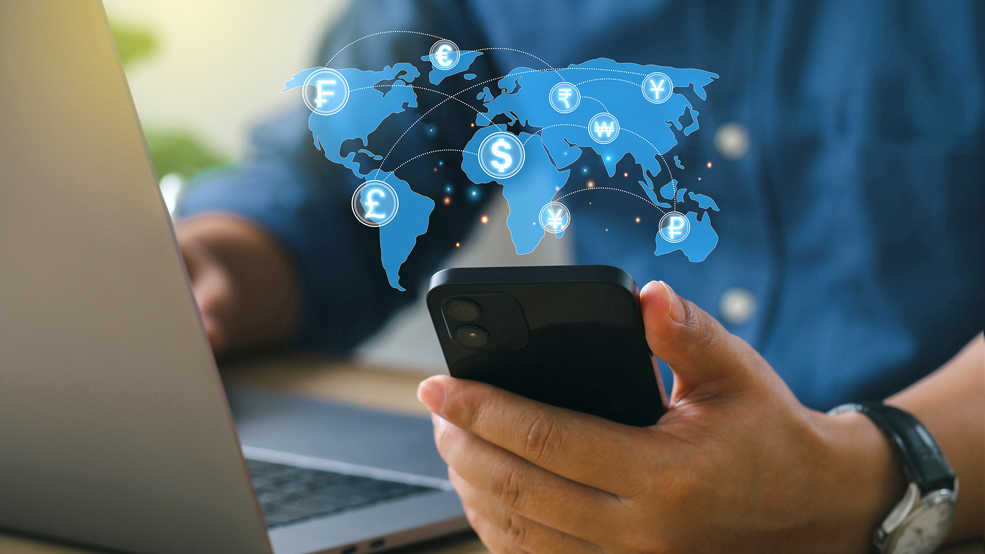 An image of different currencies placed on a map