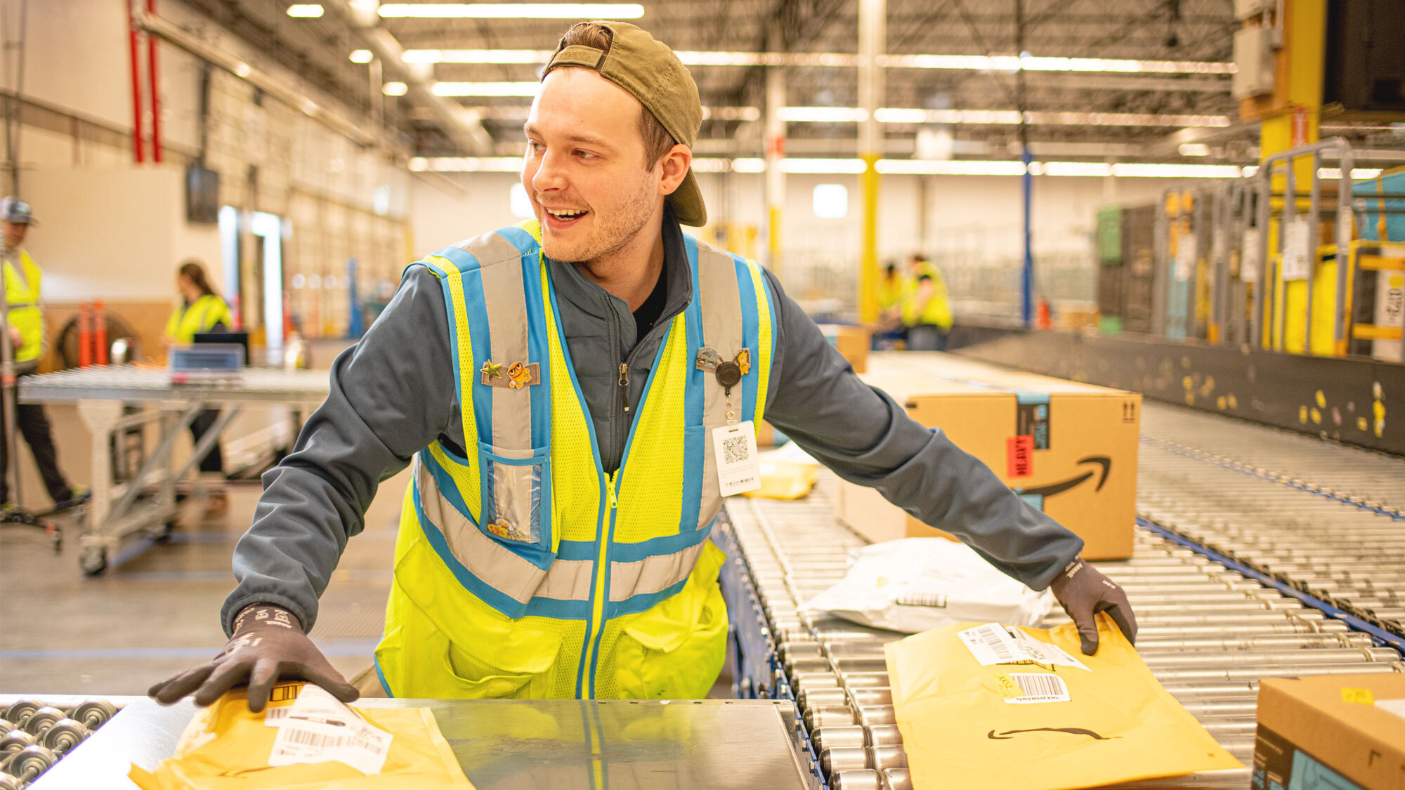 An Amazon operation employee works in a fulfillment center.