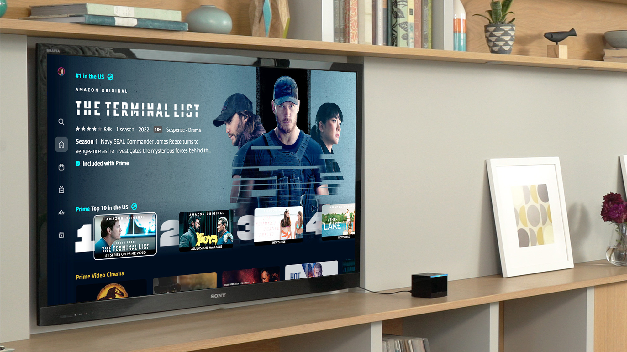 An image of a TV on a wall. On the screen is the new Prime Video design