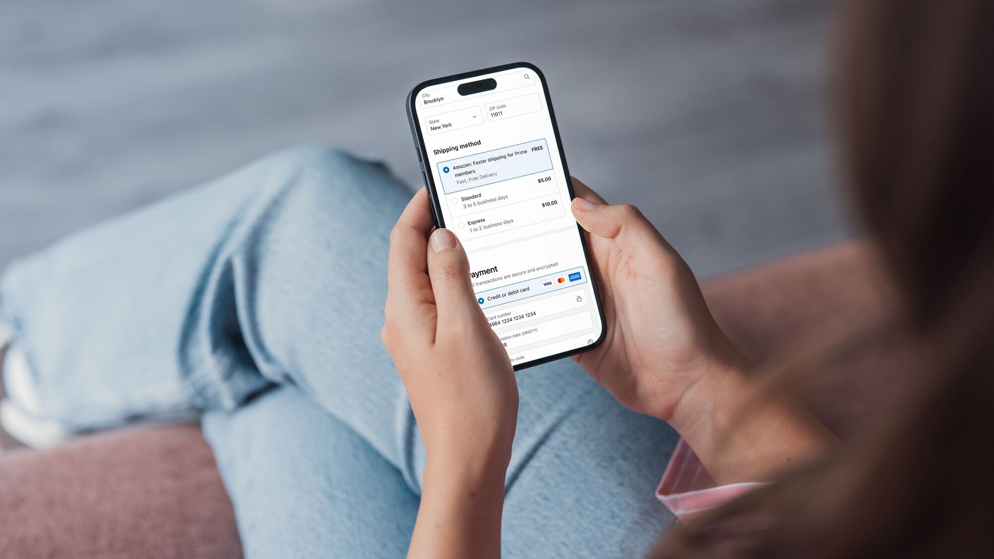 A customer navigates shipping and payment options on a mobile device