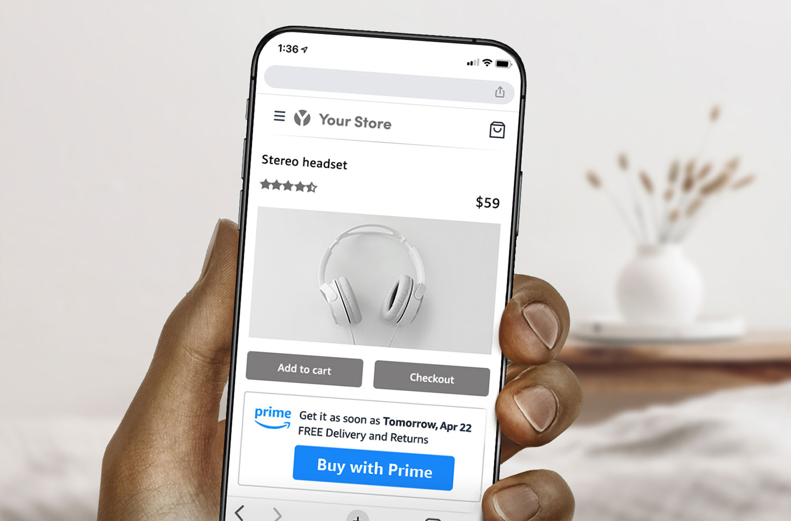 An image of a hand holding a phone. On the screen, someone is buying headphones using Amazon's Buy with Prime feature.