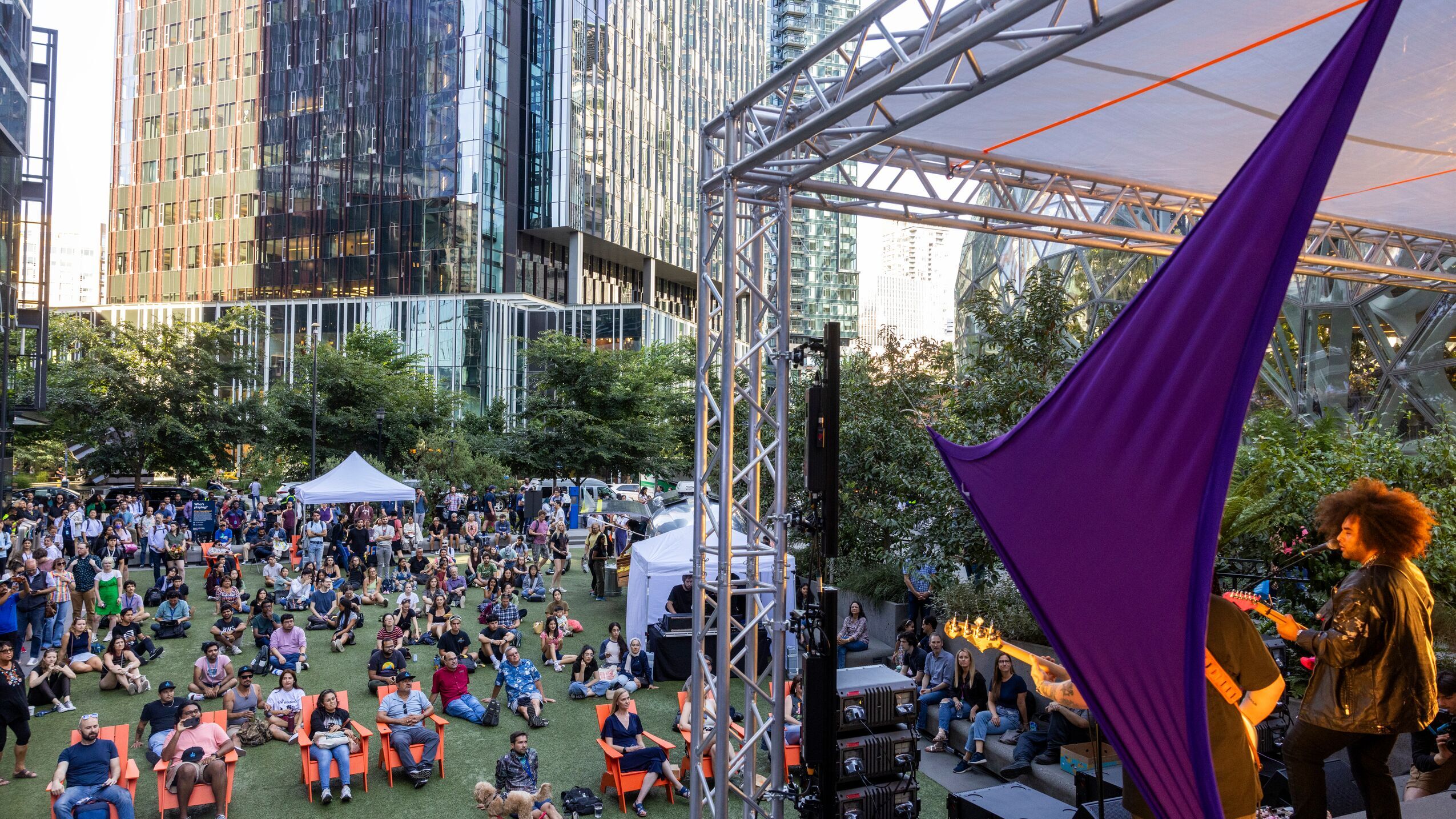 A photo of a concert that happened on the playfield at Amazon Headquarters in Seattle.