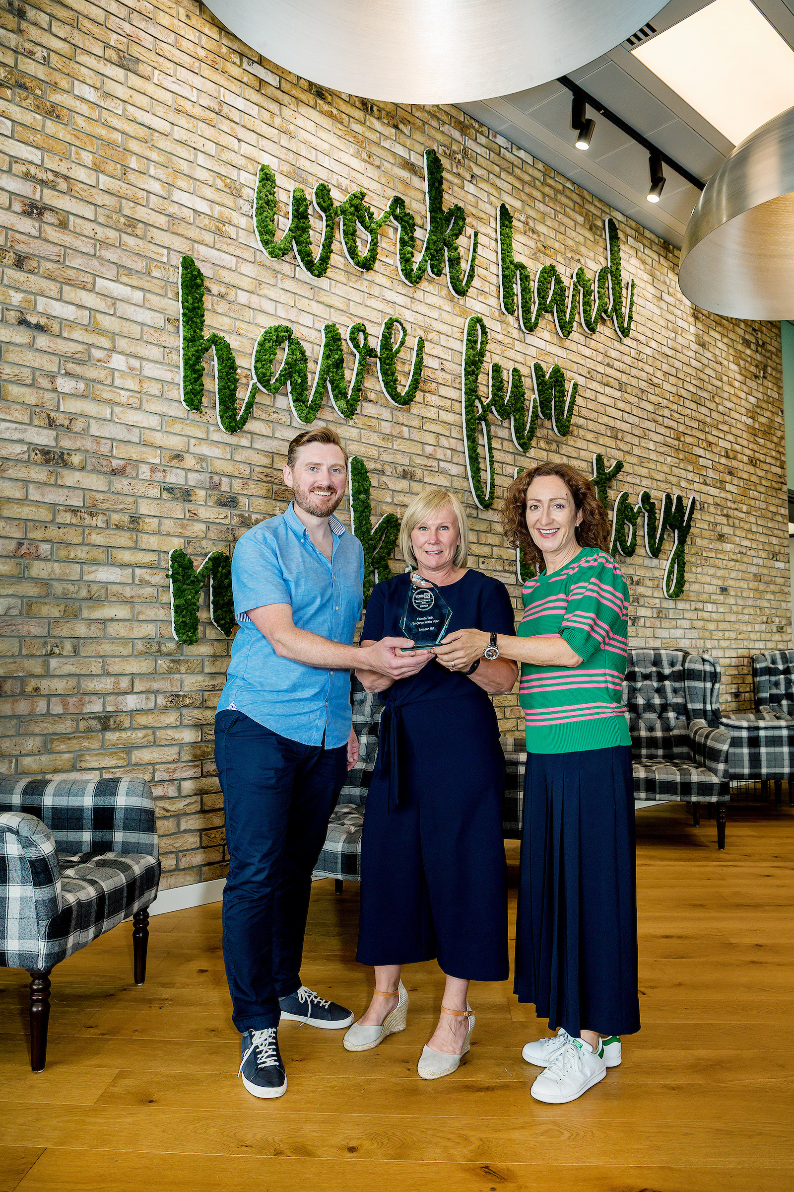 Amazon receiving female tech employer of the year award 