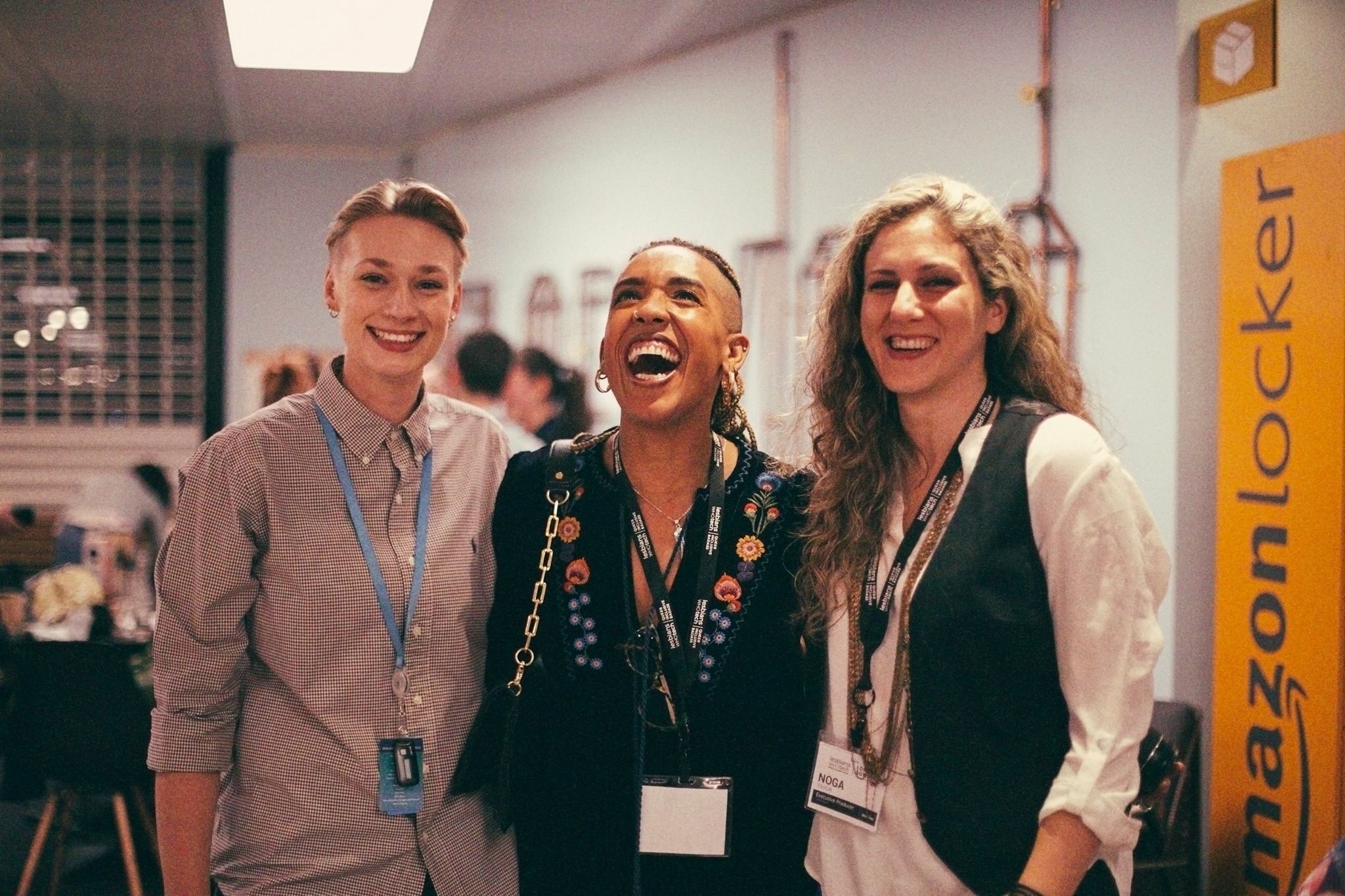 Amazon LGBT+ employees smiling and laughing