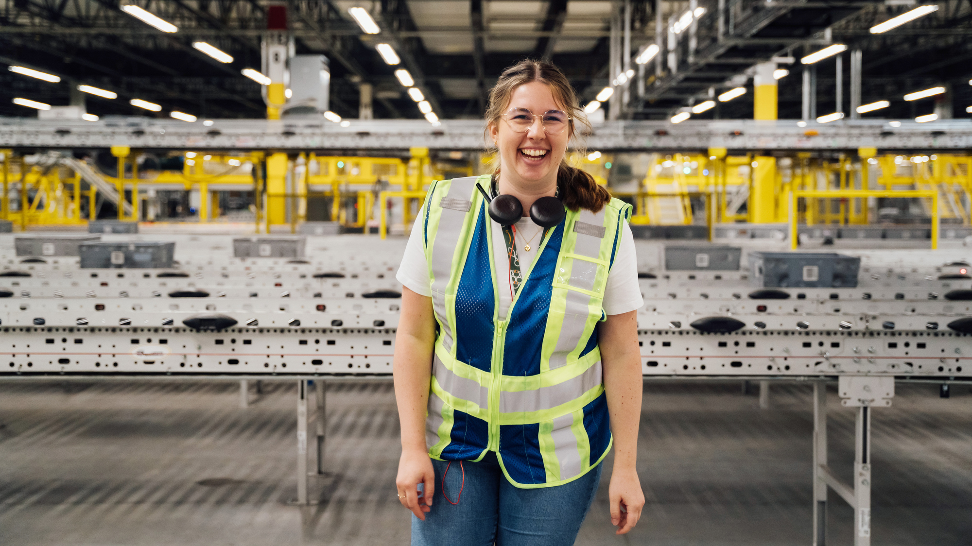 Amazon employees giving a tour of a fulfillment center.