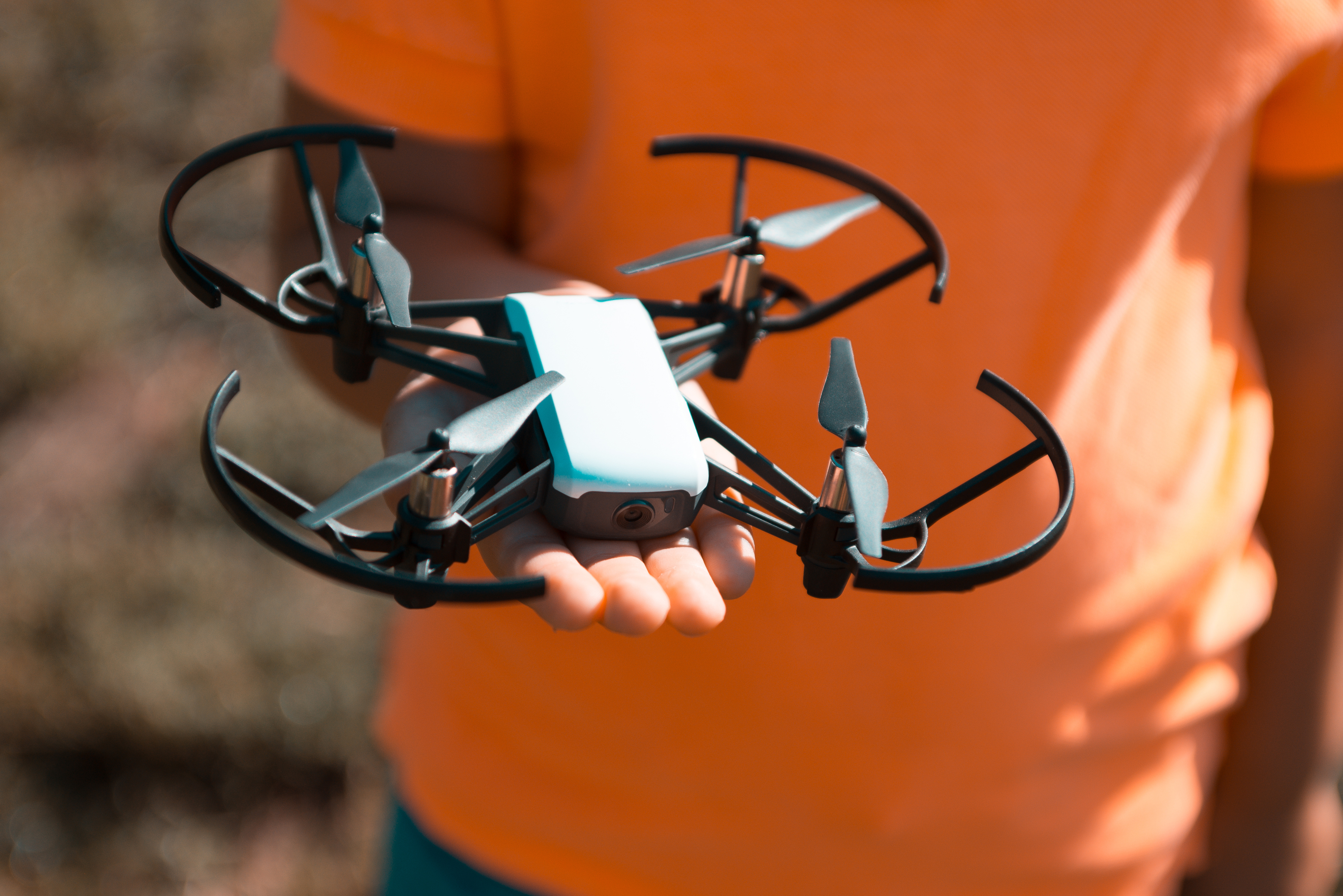 An image of a child's hand holding a drone.