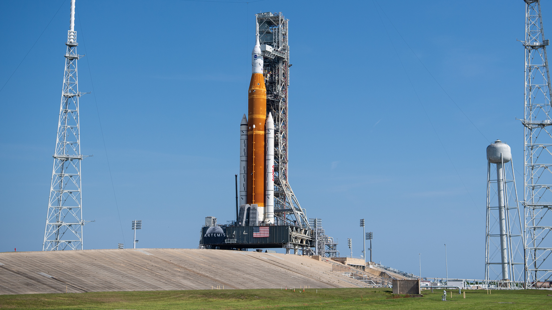 An image of NASA's Artemis I rocket outdoors preparing for launch. 