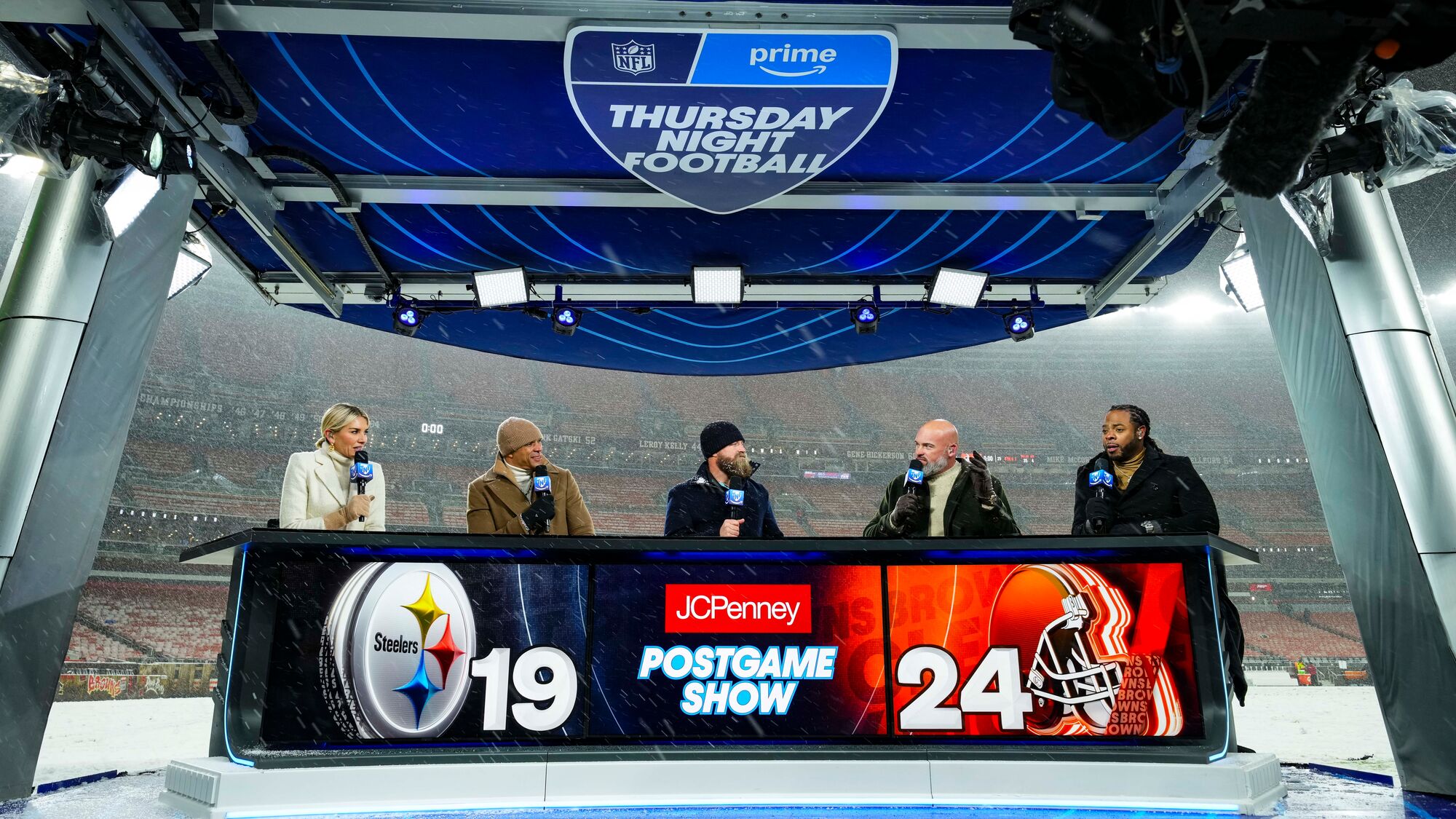 Thursday Night Football set featuring one woman and four men.