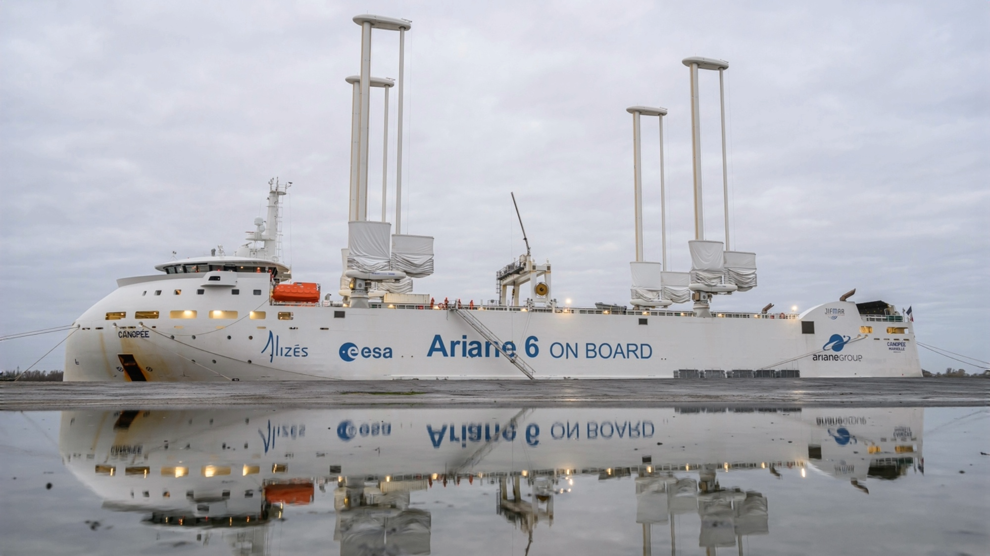 Cargo ship Canopée with Ariane 6 rocket components reflected in water
