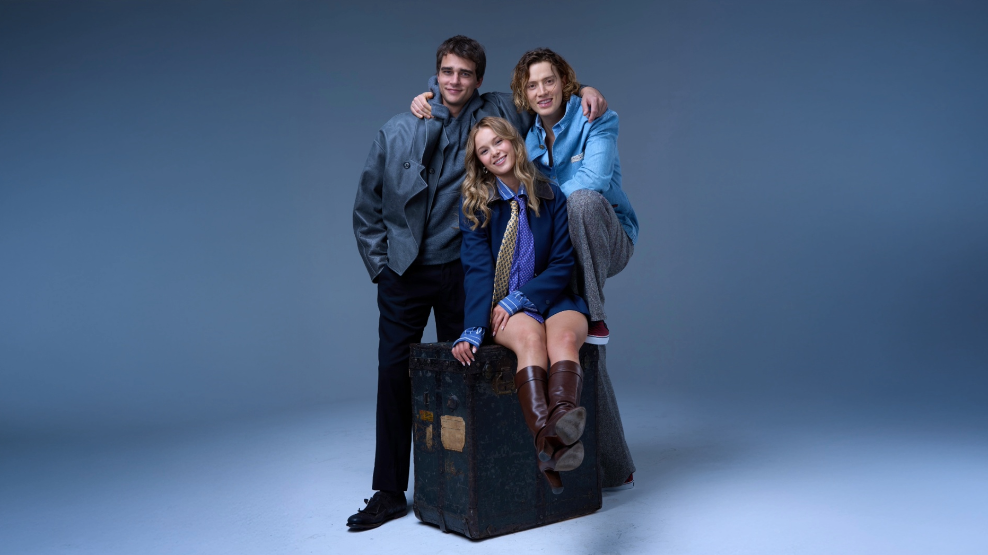 Cast of Love Love Me Sequel; Pepe Barroso, Mia Jenkins, and Luca Melucci (from left to right) posing on a suitcase