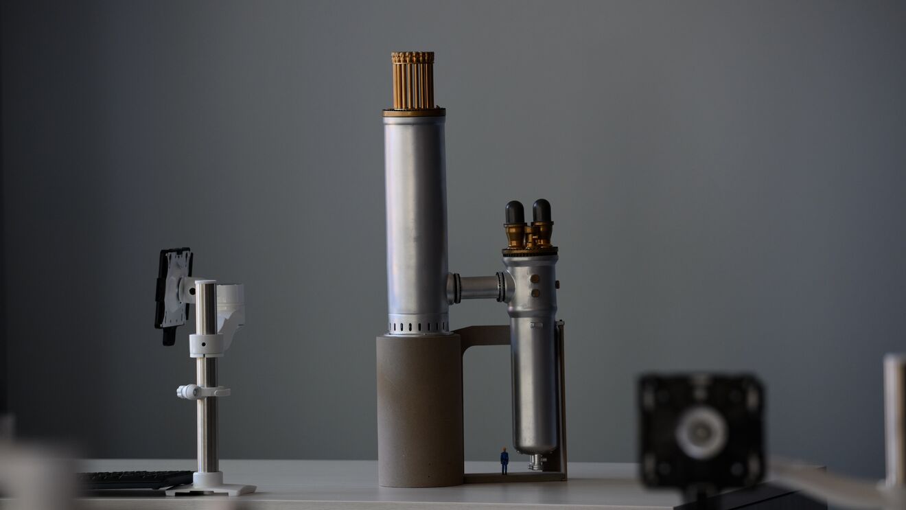 Laboratory setup with microscope, stand, and small camera