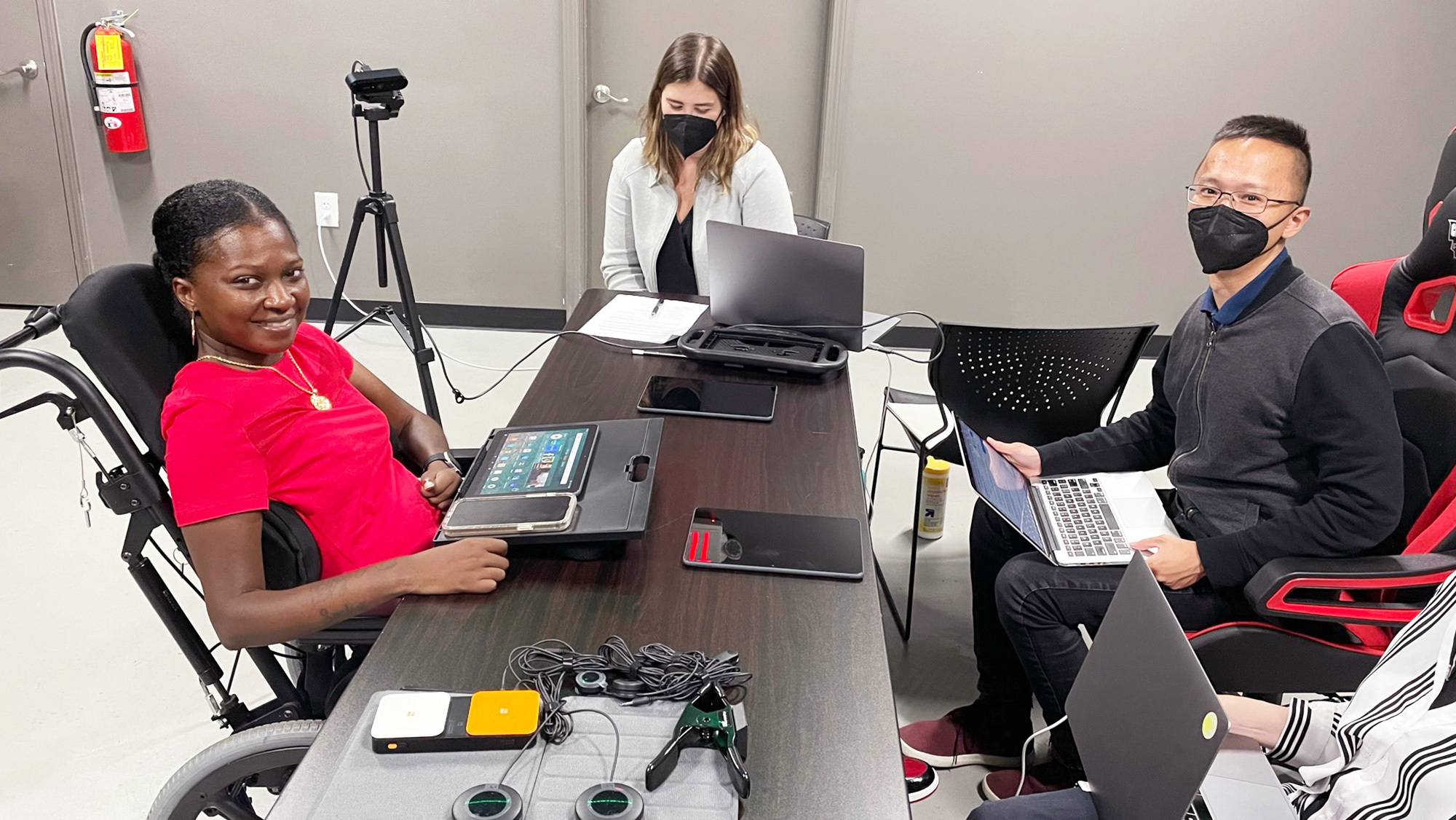 An image of three people using Alexa's accessibility features in Amazon's Fire tablets. 