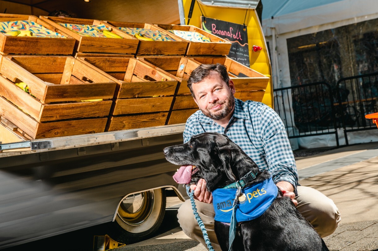 Chris and Sadie hang out by the banana stand at Amazon's headquarters.