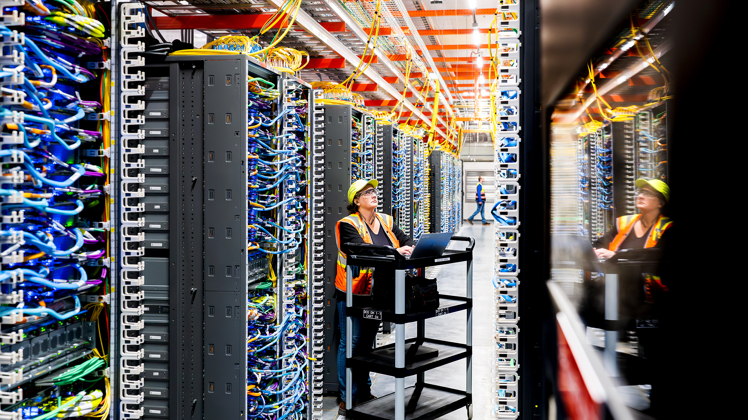 A Data Center Technician working on a laptop device.