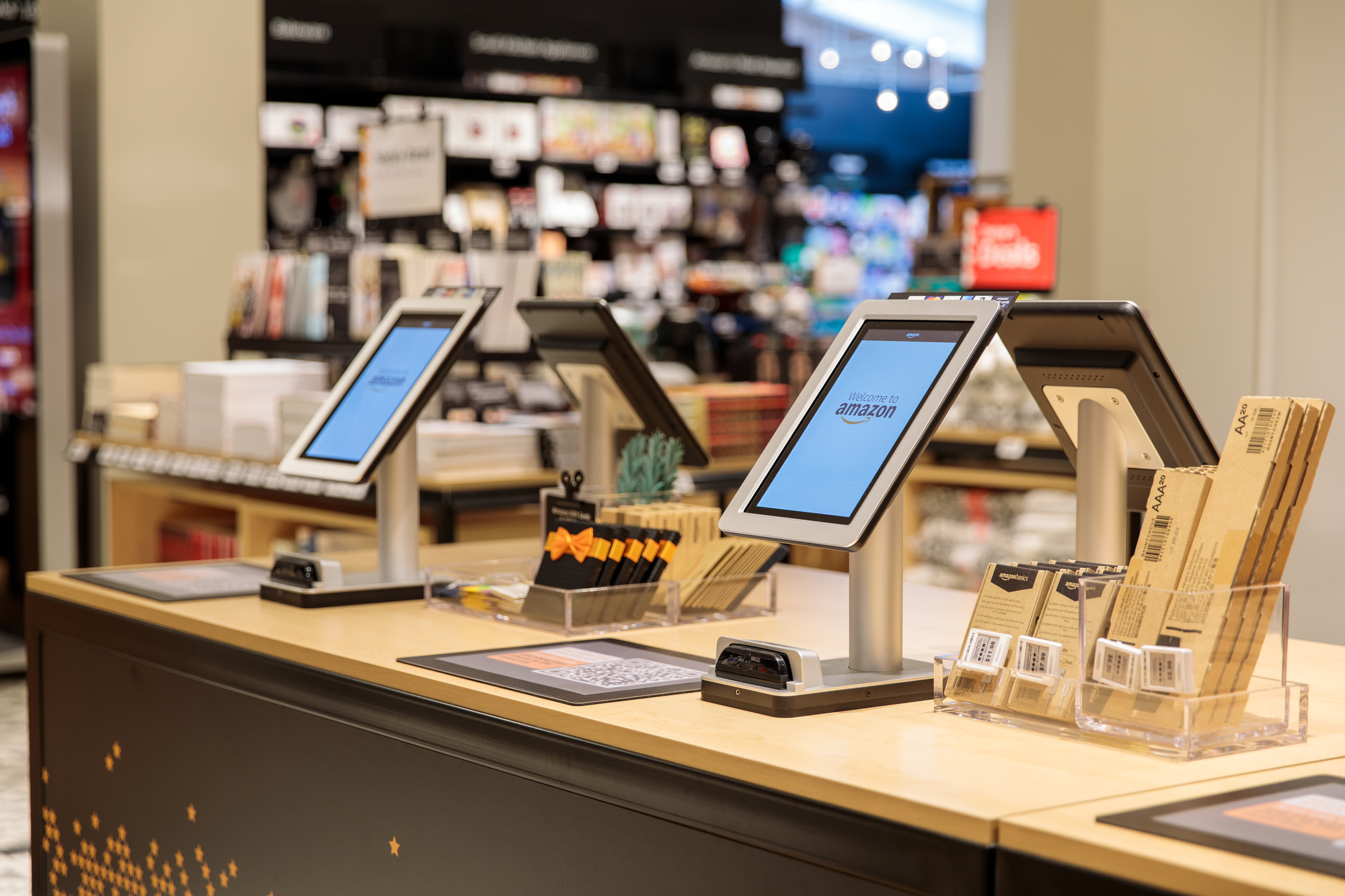 Checkout kiosks at the Amazon 4-star store. The four checkouts include a tablet, card reader, barcode to scan from the Amazon app, along with batteries and Amazon gift cards. 