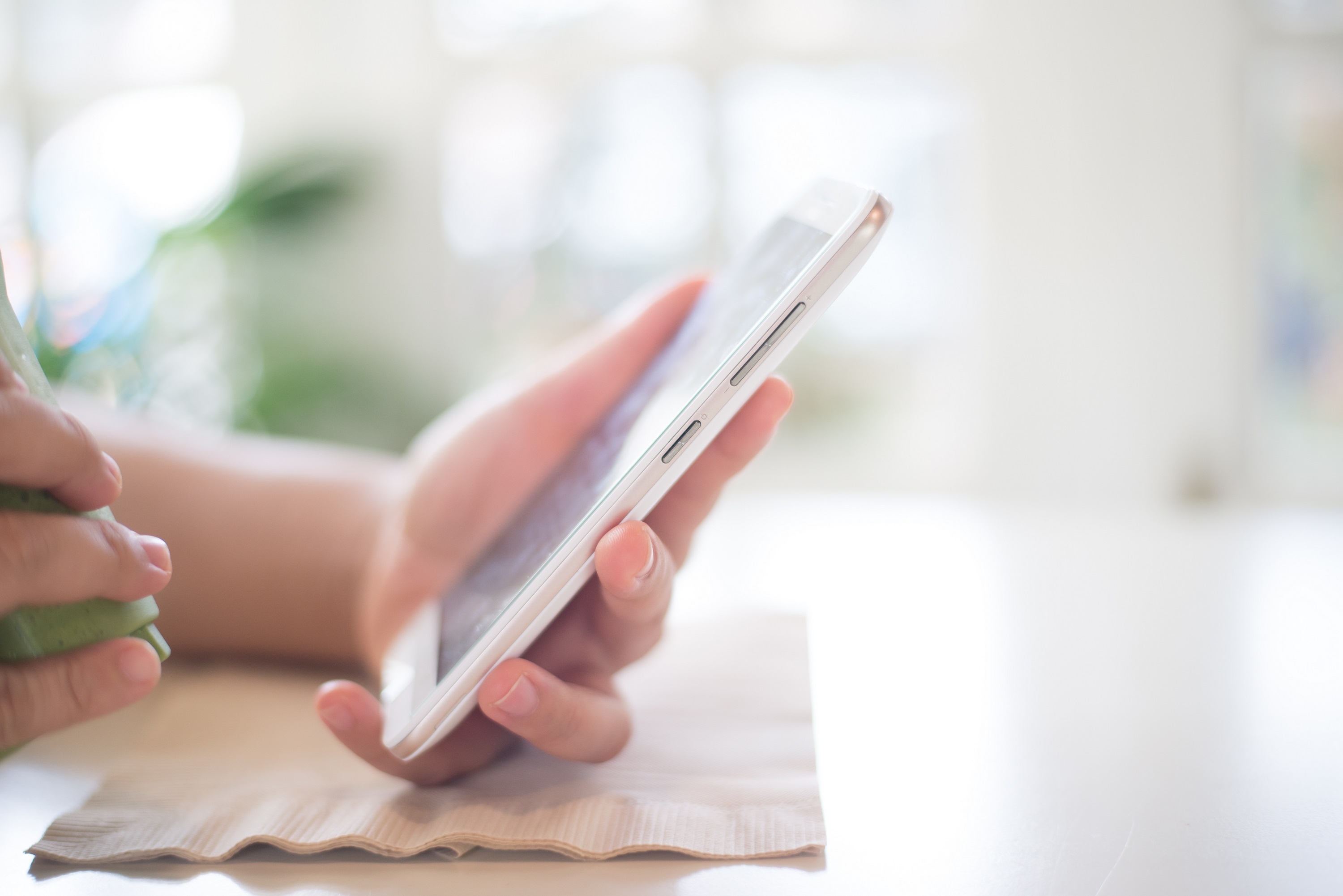 An image of a hand with a mobile phone