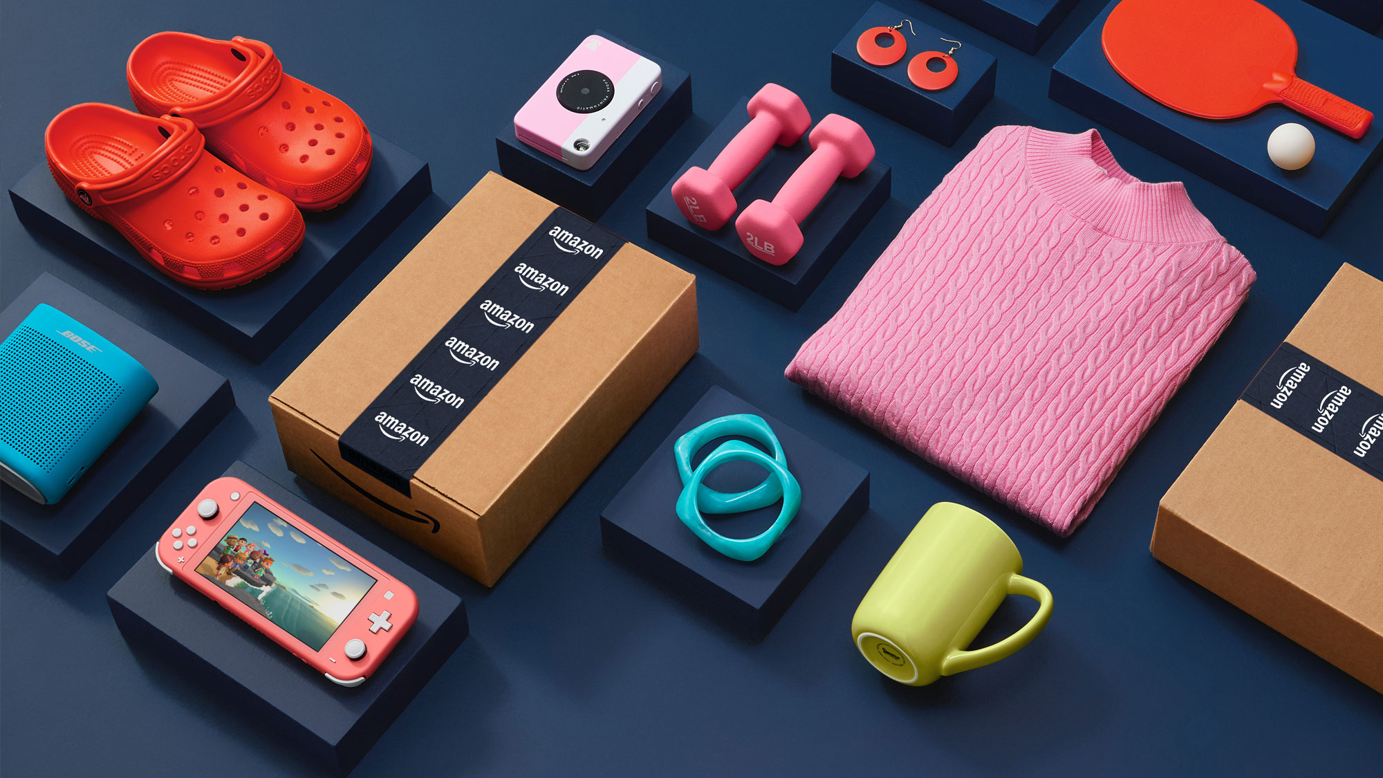 Colorful product array including Crocs, Amazon boxes, and Nintendo Switch