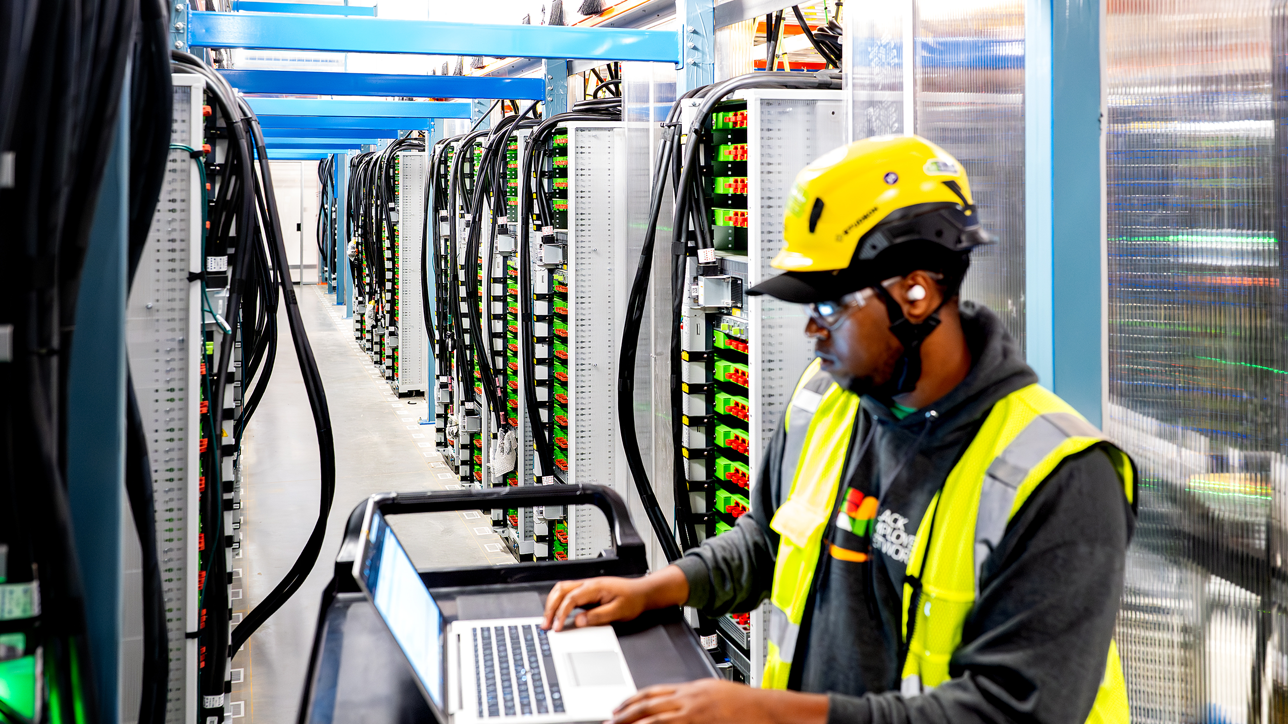 A technician working on a laptop.