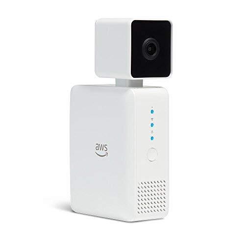 A device, consisting of a white box topped with a camera in a cube-shaped casing. The Amazon Web Services logo is on the side.