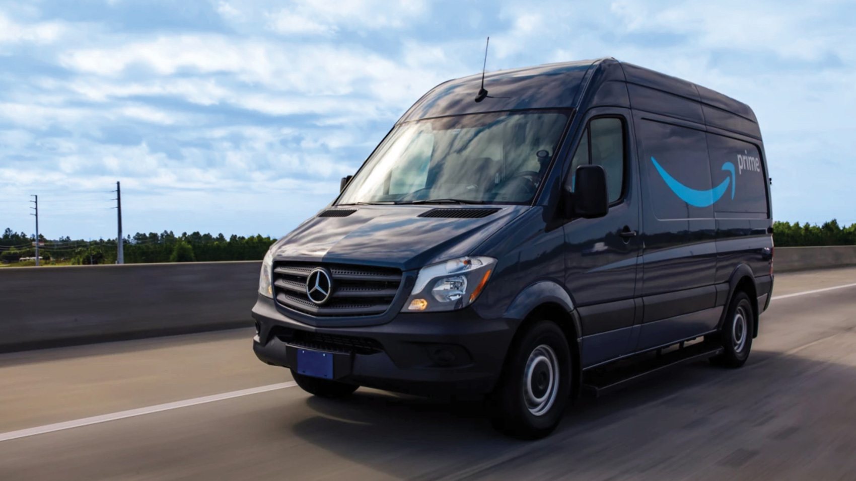 An image of an Amazon delivery van on the road