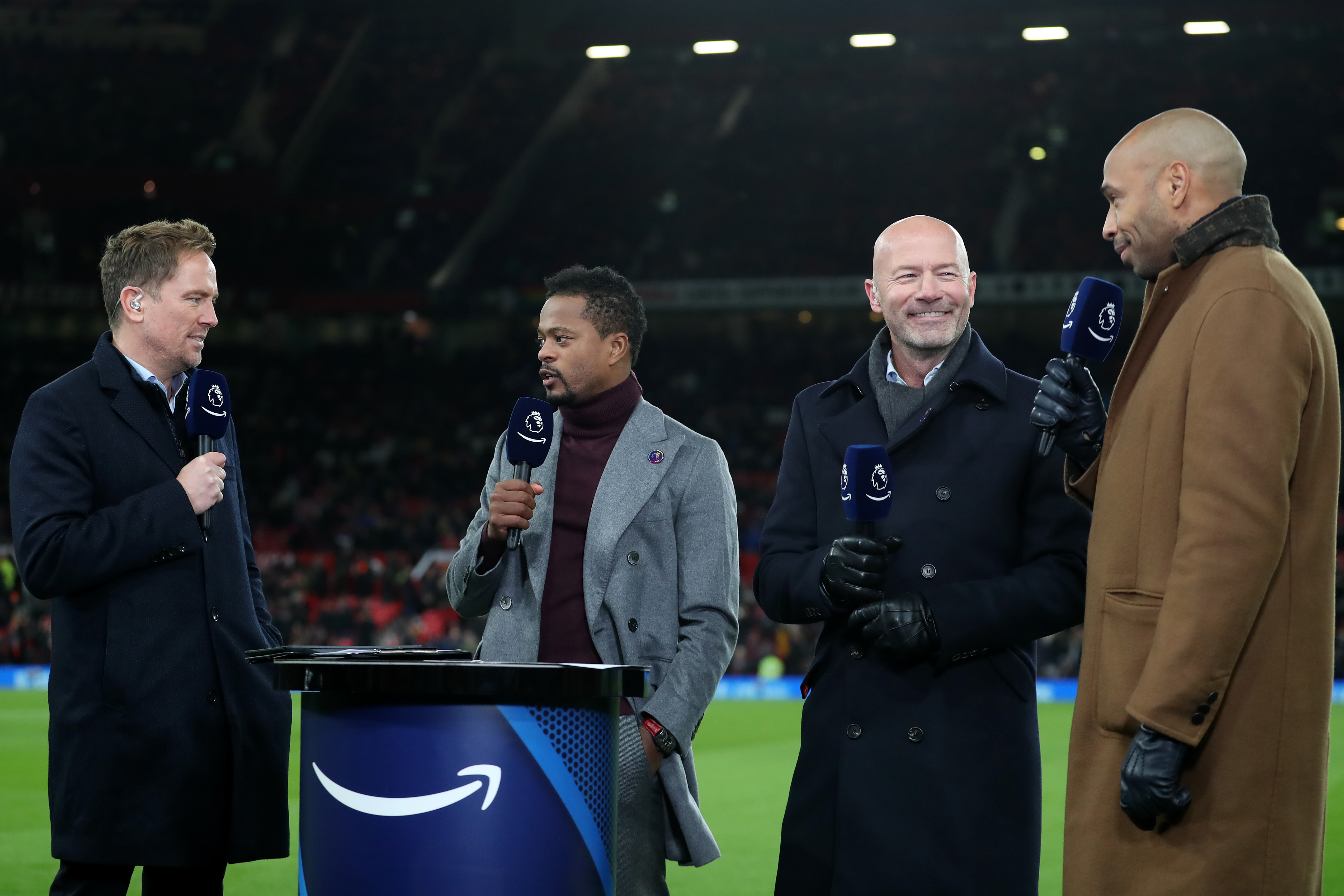 Three premier league pundits discuss a football match as it happens