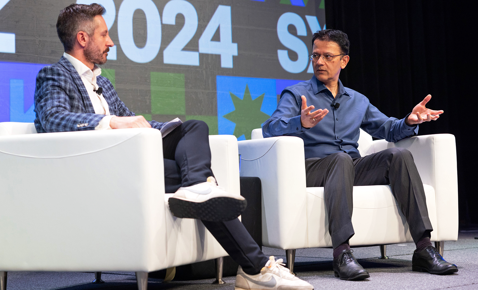 Ryan Heath, co-author, Axios AI+ interviewing Vishal Sharma, VP, AGI, onstage at SXSW 2024 in Austin, Texas.