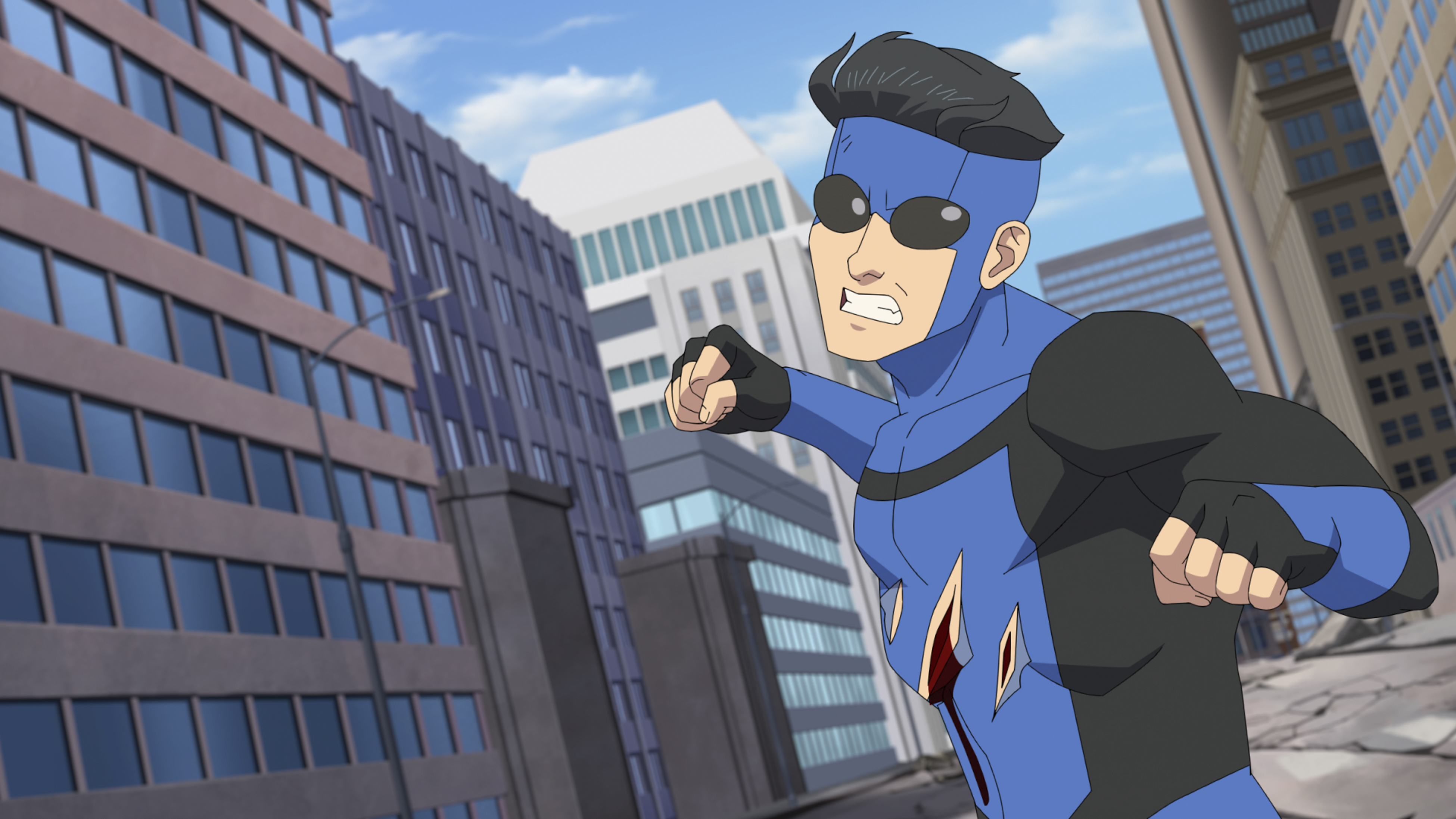 Invinvible from Prime Video: Superhero in blue costume leaping into action in cityscape