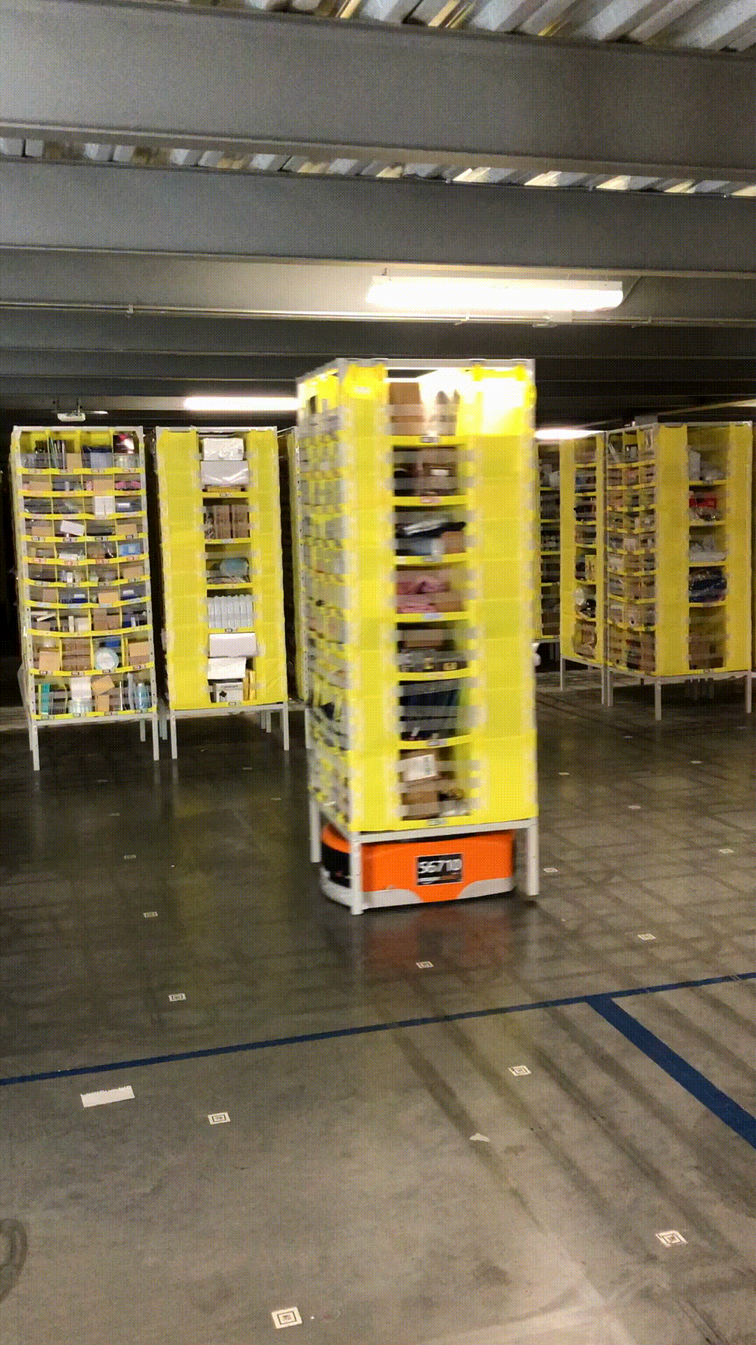 Robots inside an Amazon fulfillment center moving product