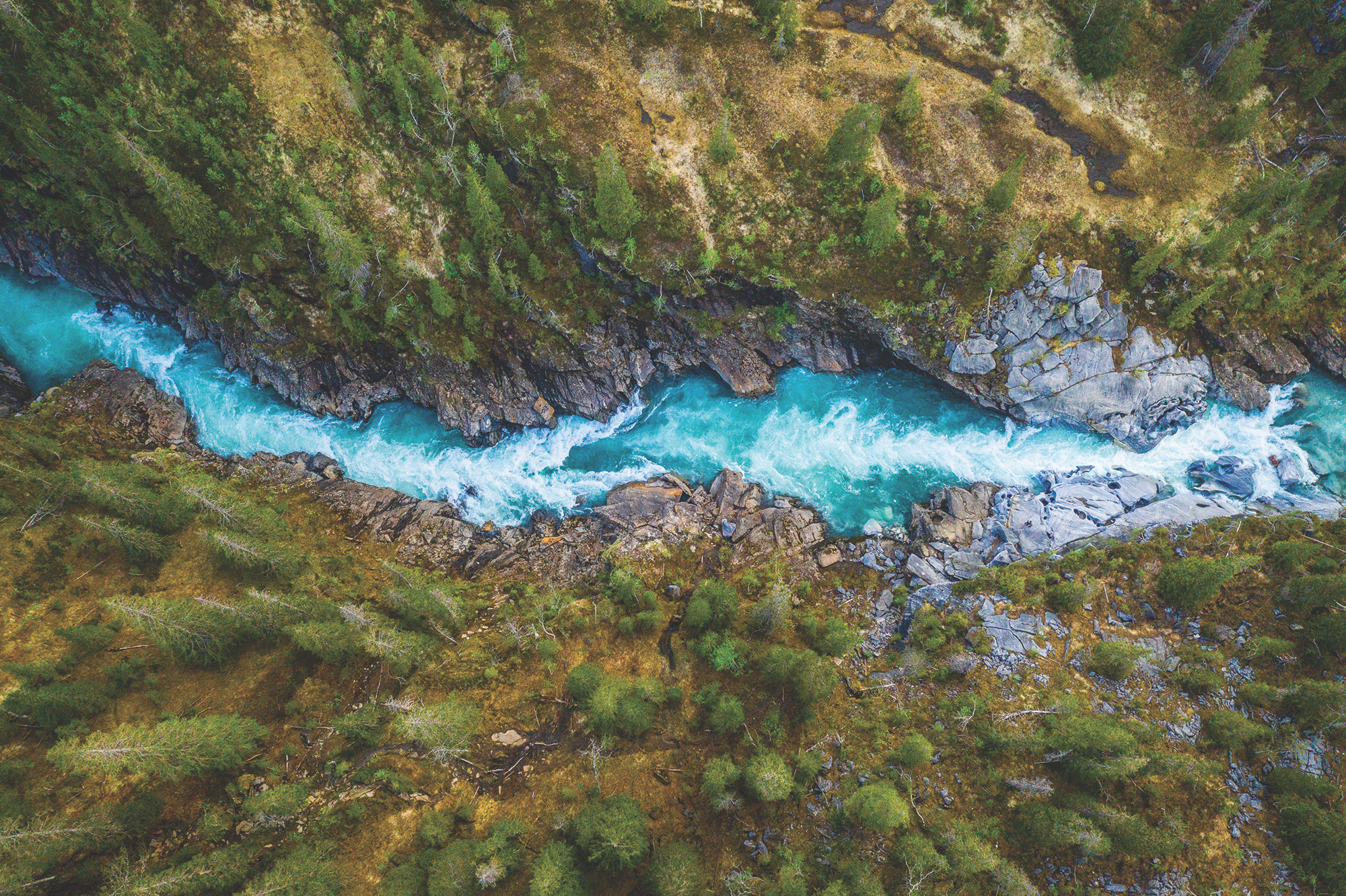 Aerial Vertical View Over The Surface Of A Mountain River Glomaga