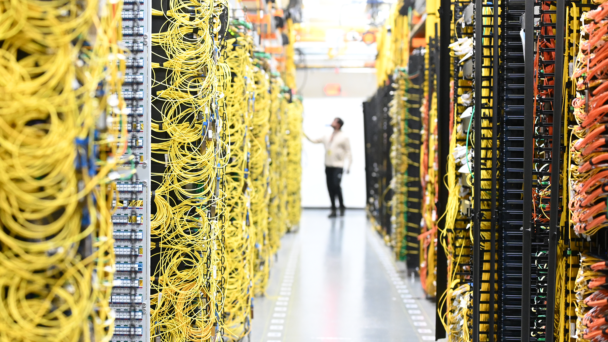 A data center technician working inside an AWS data center