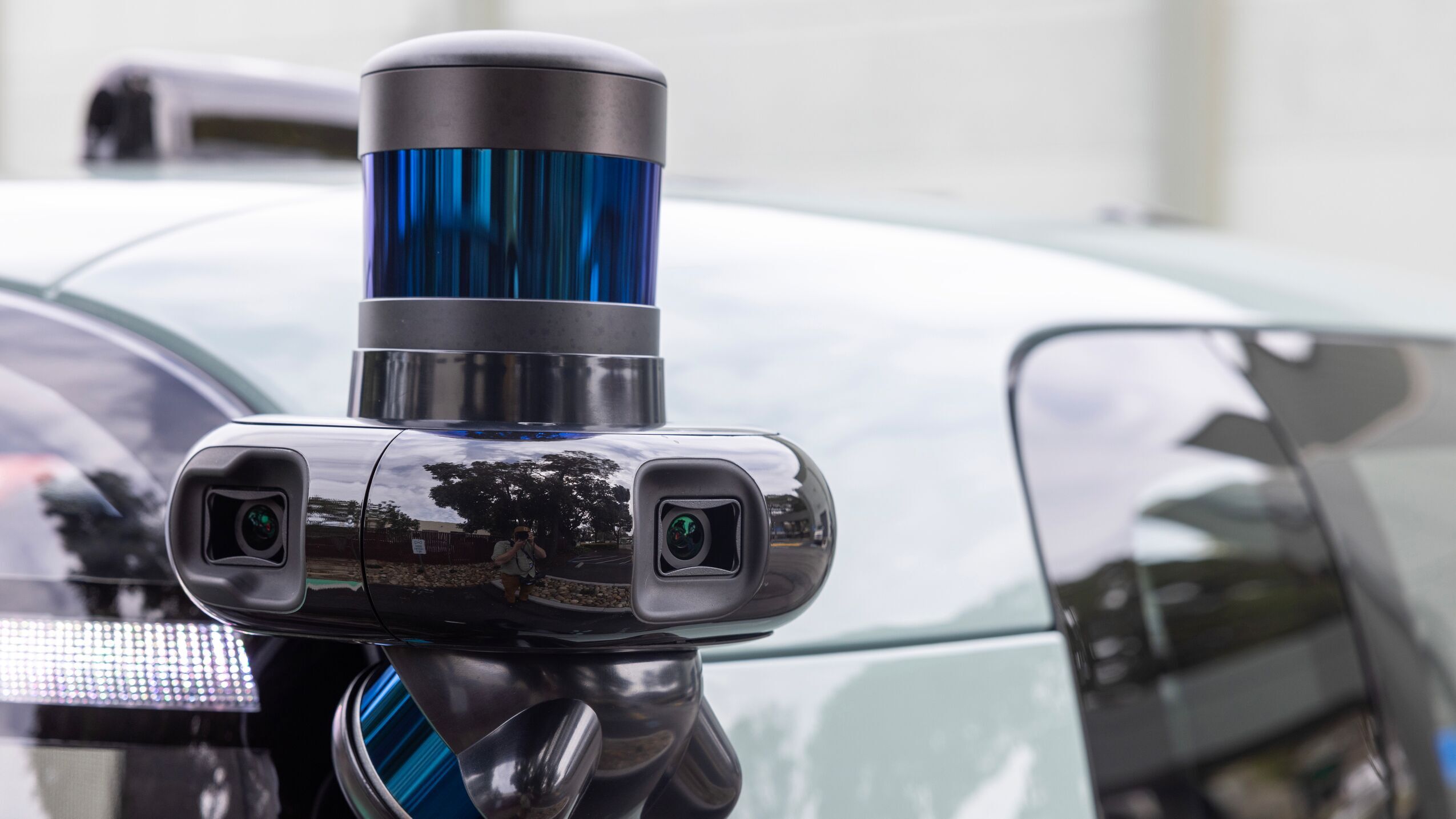 An image of cameras atop the roof of a Zoox robotaxi.