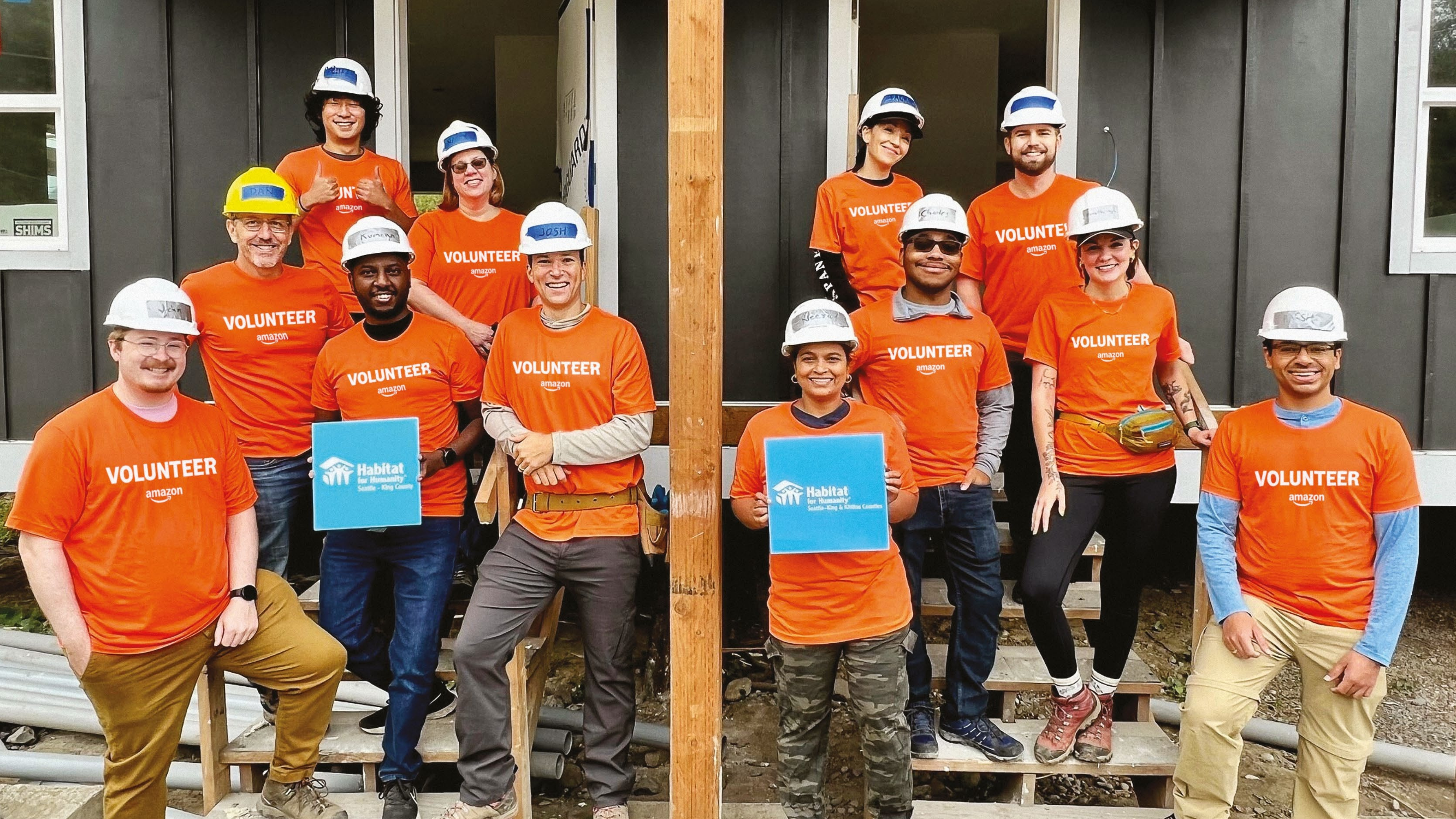 Amazon volunteers with Habitat for humanity posing for a photo