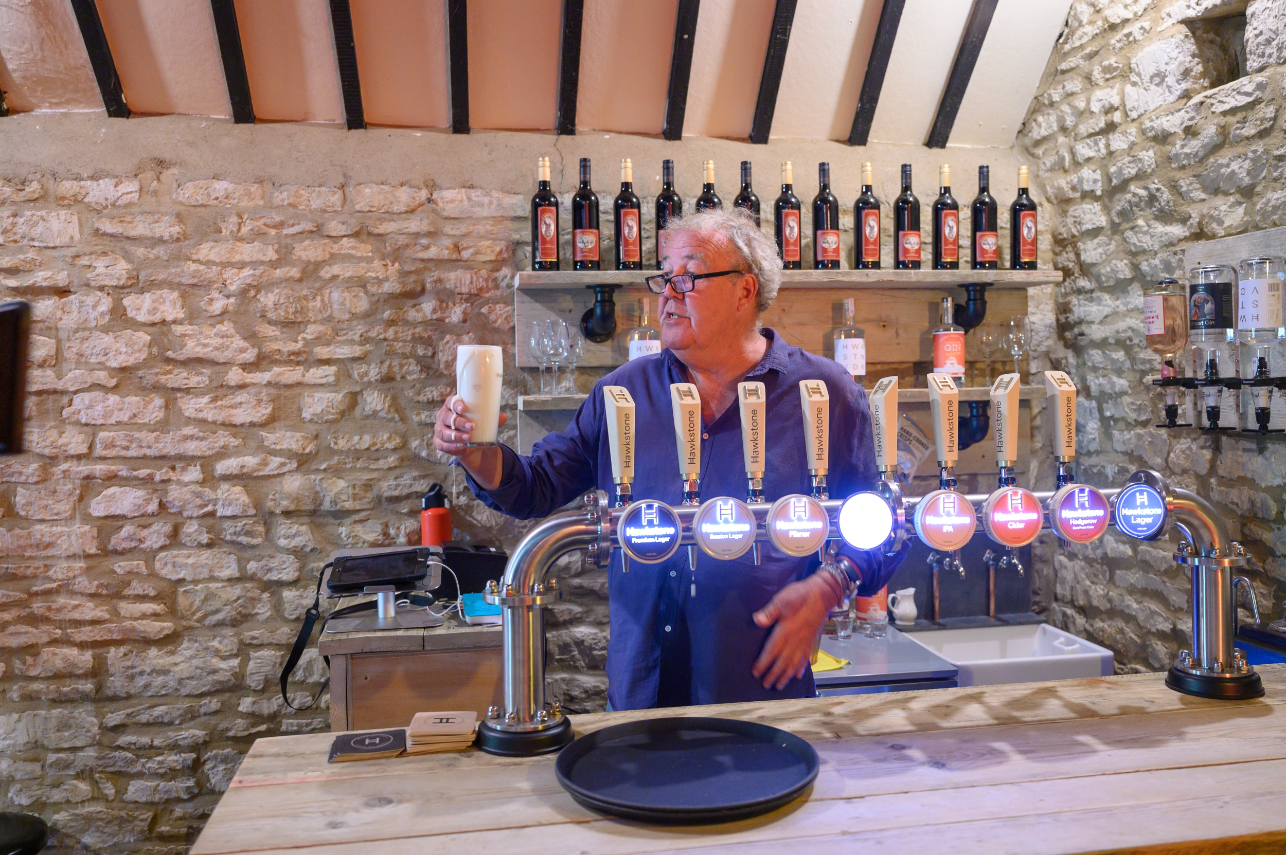 Jeremy behind the bar of The Farmer's Dog Pub in Clarkson's Farm series 4.