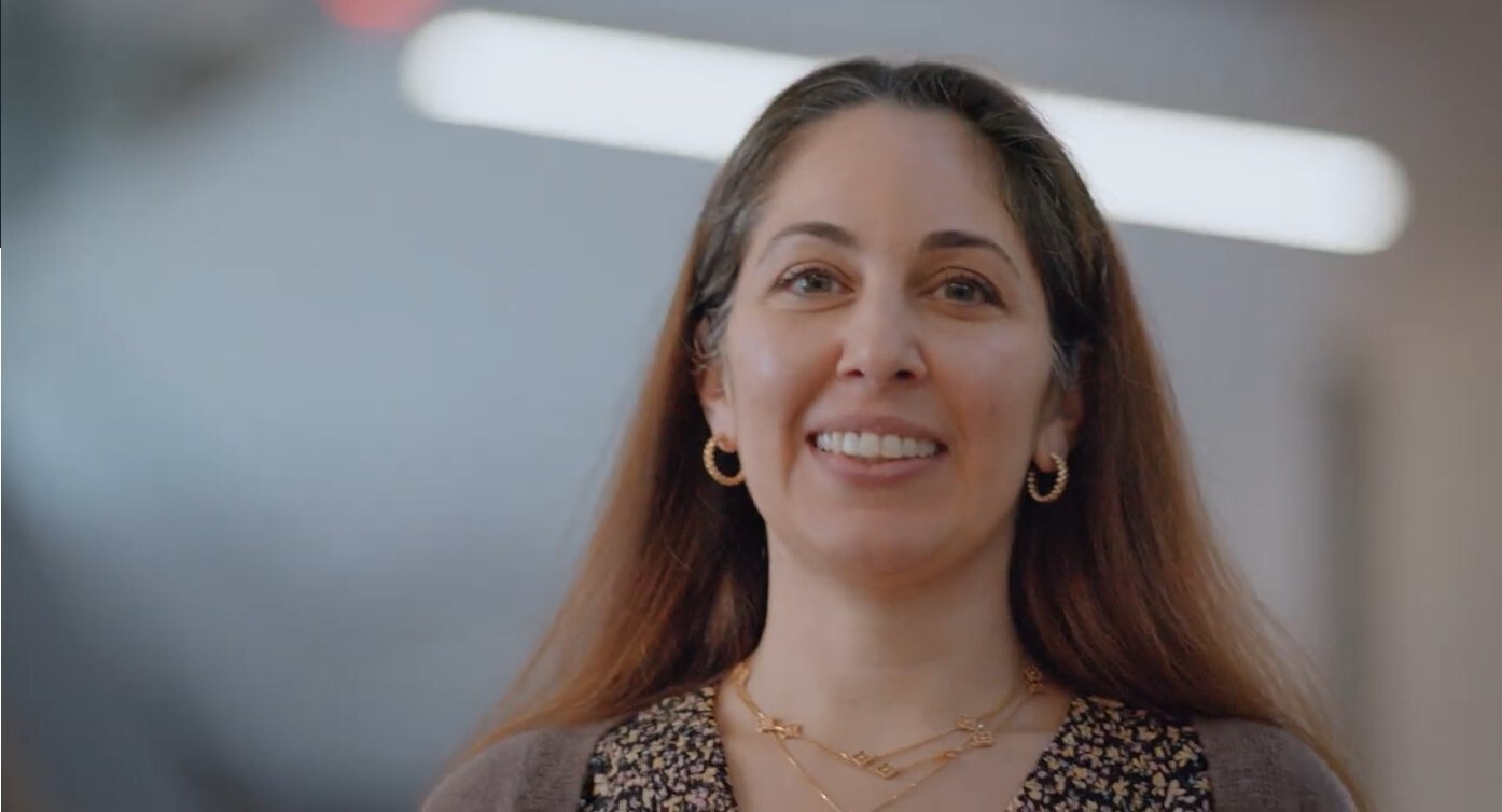 A woman smiling.