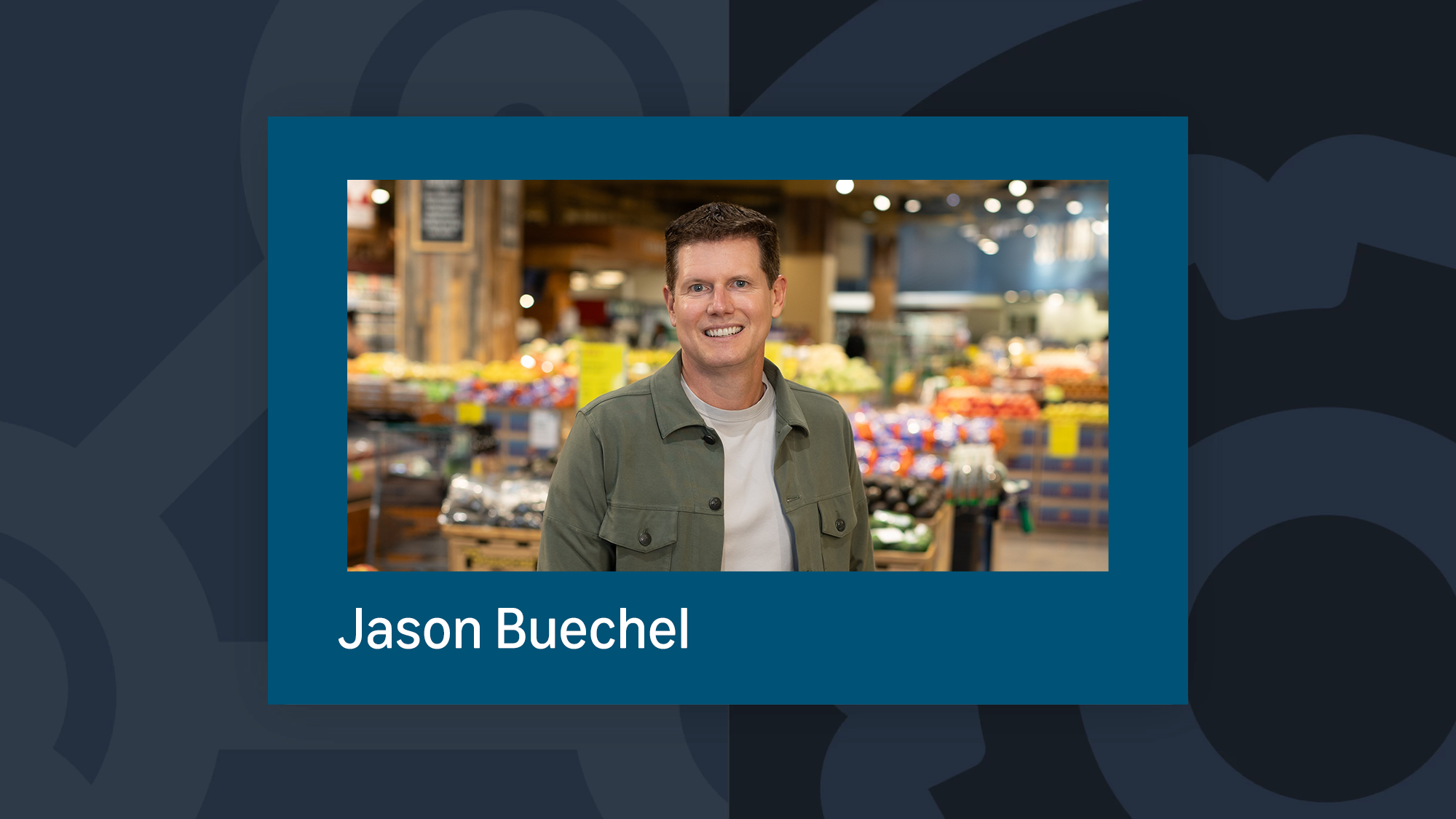 Jason Buechel smiles in the produce section of Whole Foods Market 