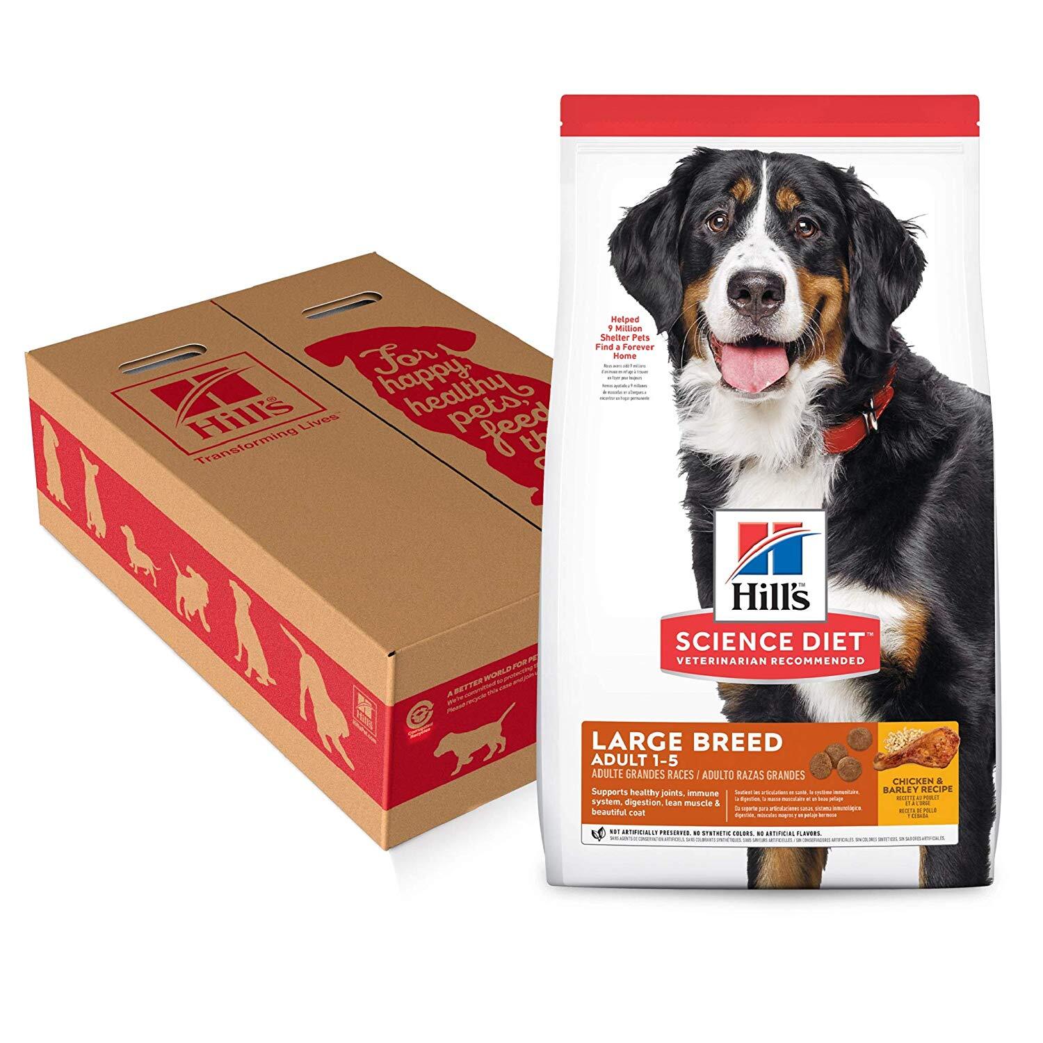 A bag of Hill's dog food next to a cardboard box decorated with silhouettes of dogs.