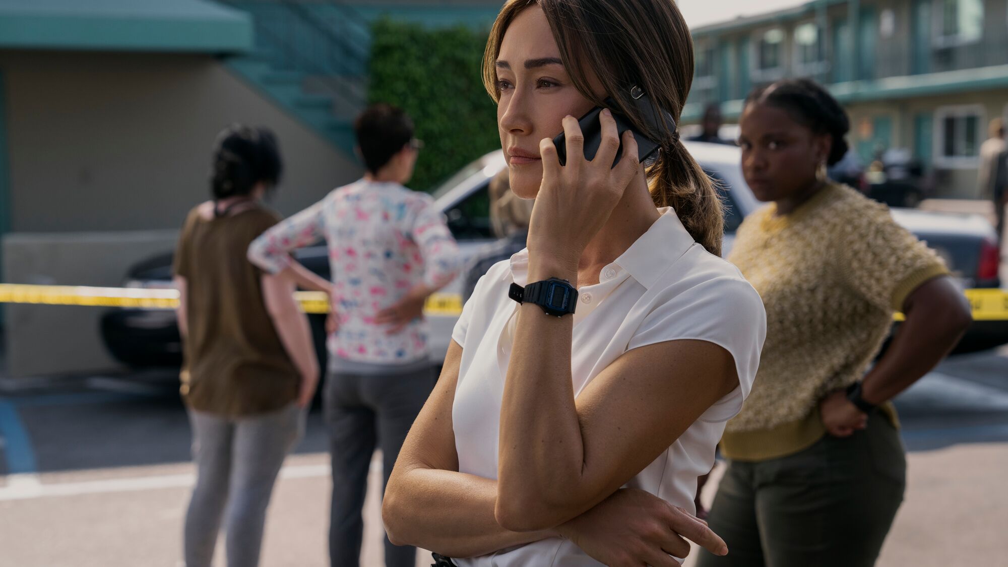 A woman is holding a phone