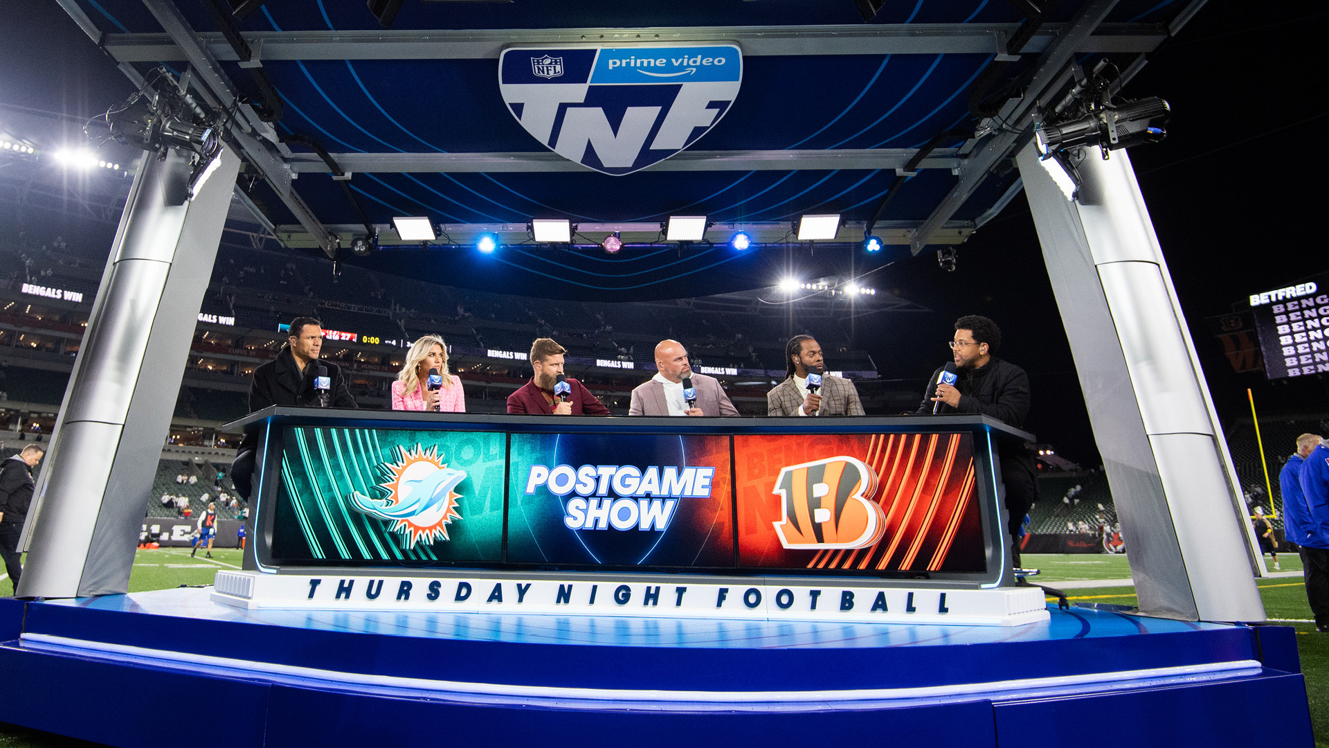 An image of the hosts of TNF postgame show talking on set. 