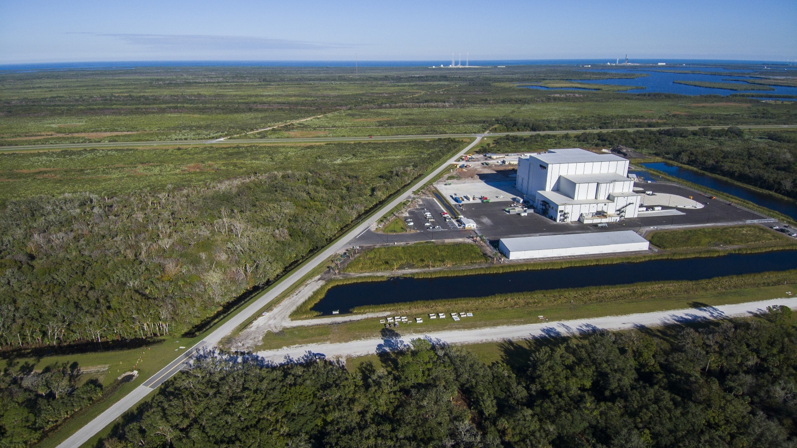 Exeterior drone shot of Amazon Kuiper facility in Florida
