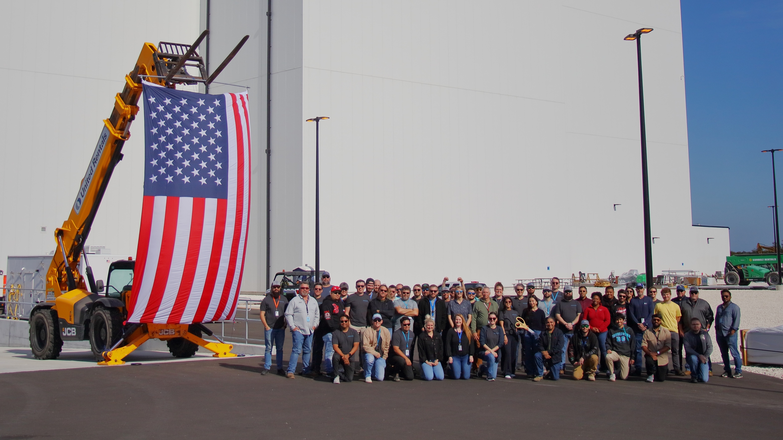 Team celebrating opening of Kuiper facility