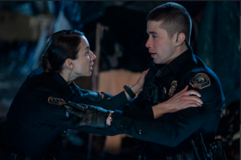 Troian Bellisario and Brandon Larracuente as police officers in On Call