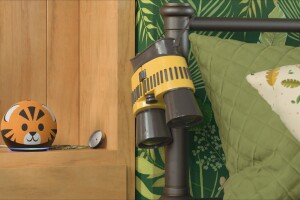 An image of a Tiger Echo Dot Kids sitting on a nightstand next to binoculars hanging from the head of a bed.