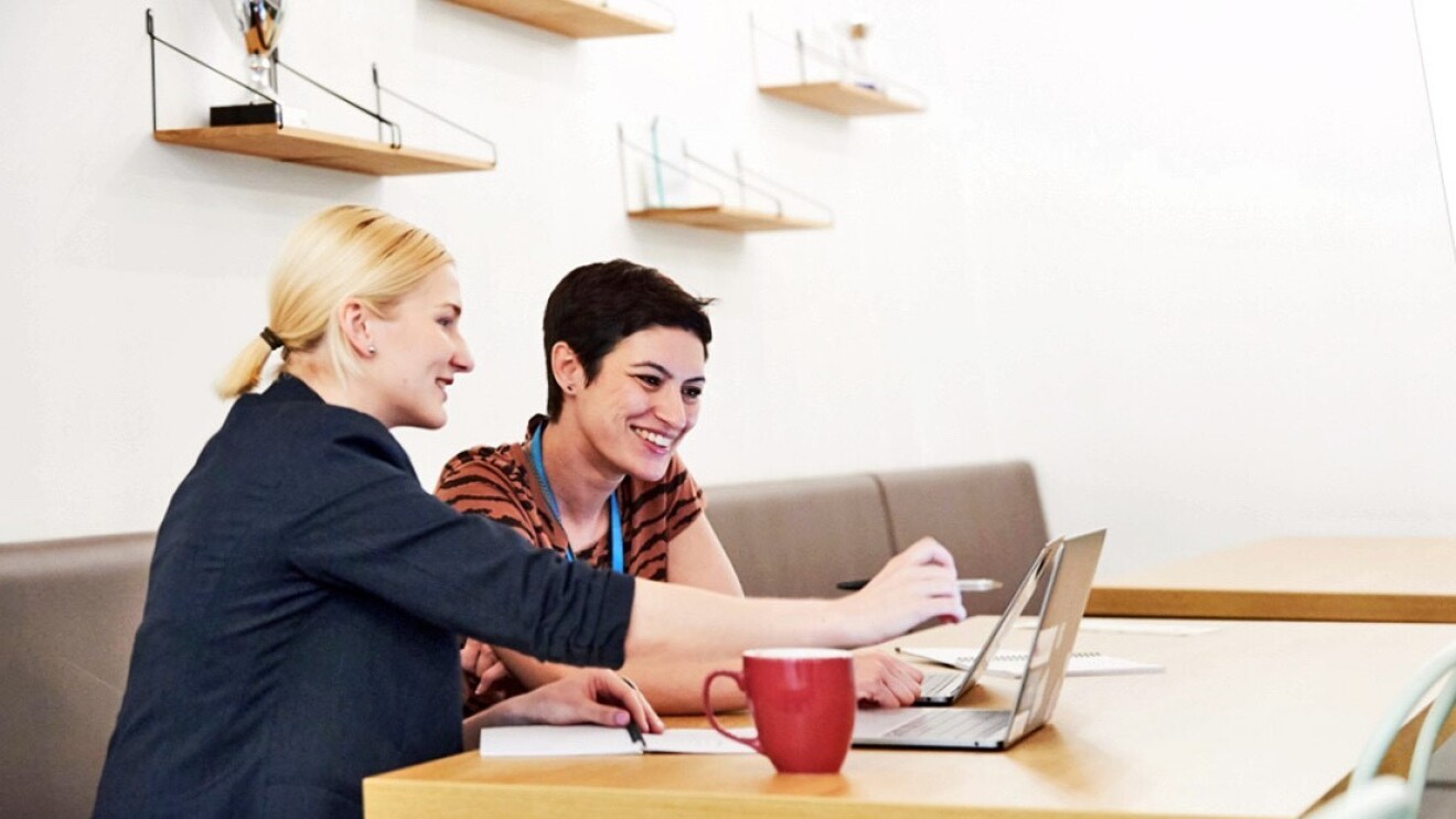 Amazon female employees having a discussion about ideas