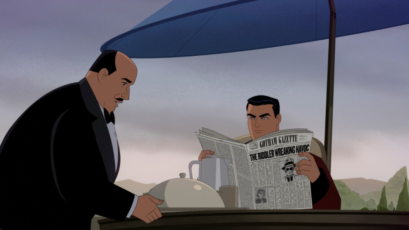 Still from Prime Videos' 'Batman: Caped Crusader' Season 2: Alfred serving tea to Bruce Wayne reading the Gotham Gazette with headline about the Riddler