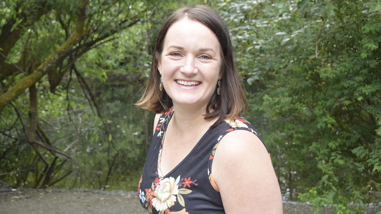 A photo of JoAnna Hunt, Principal Project Manager leading the Kindle Accessibility Team and Director of A11yCon.